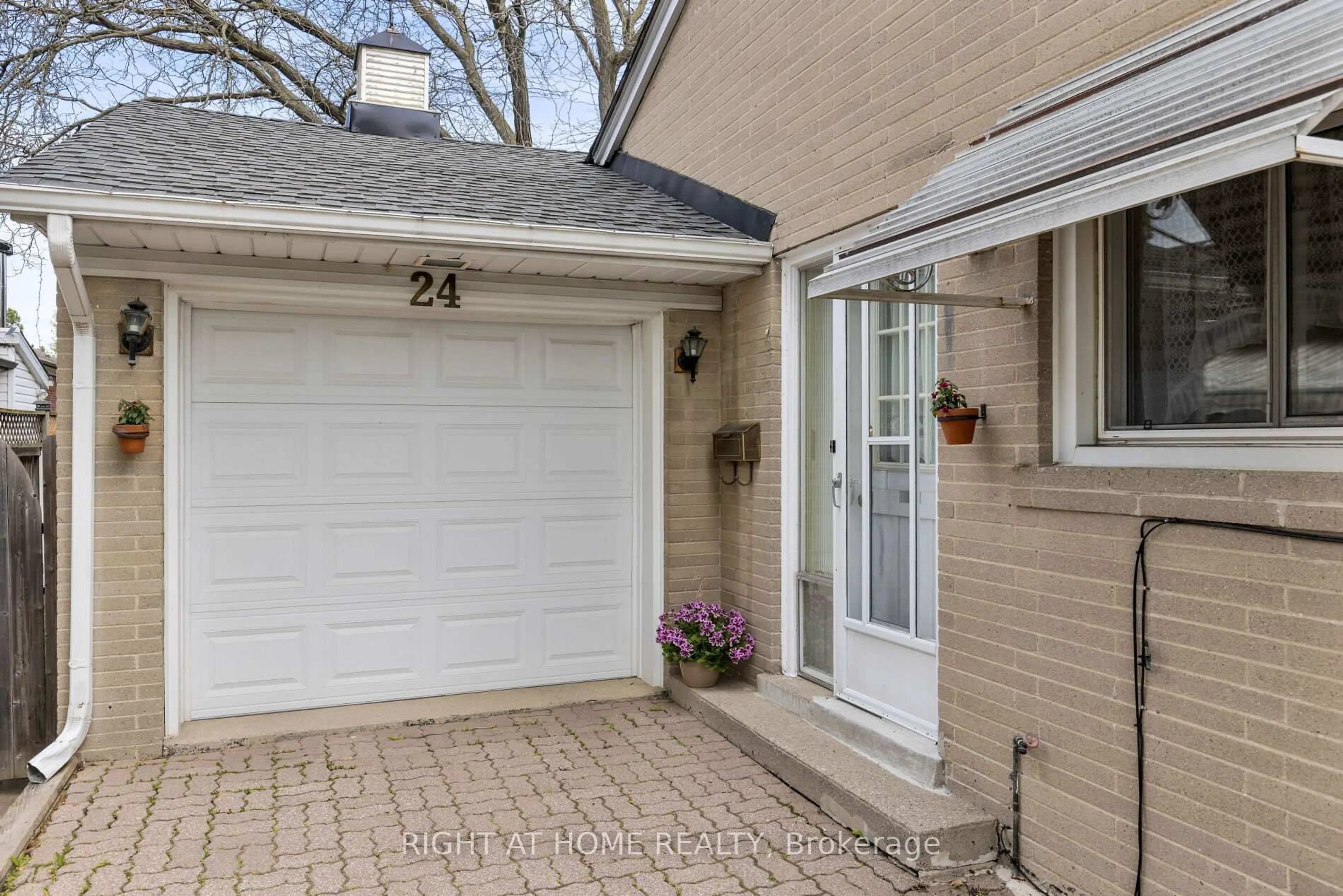 Home with brick exterior material, street for 24 Pitcairn Cres, Toronto Ontario M4A 1P4