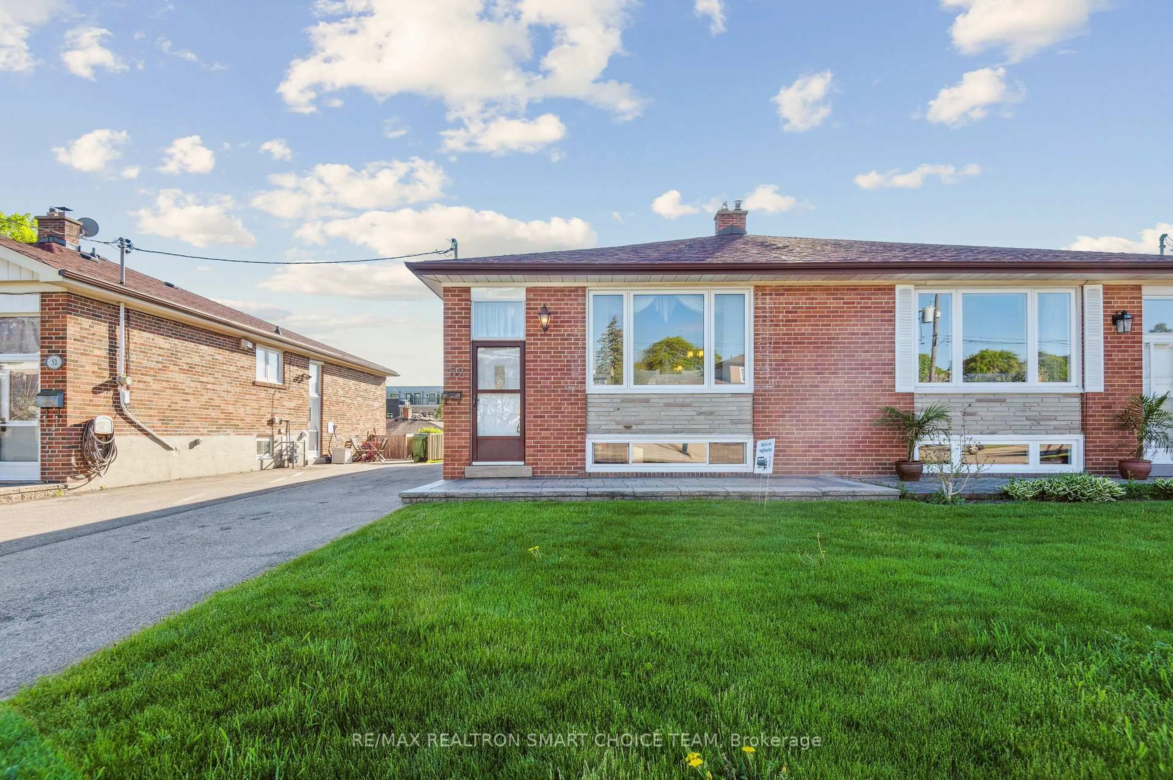Home with brick exterior material, street for 52 Pinebrook Ave, Toronto Ontario M4A 1Z2