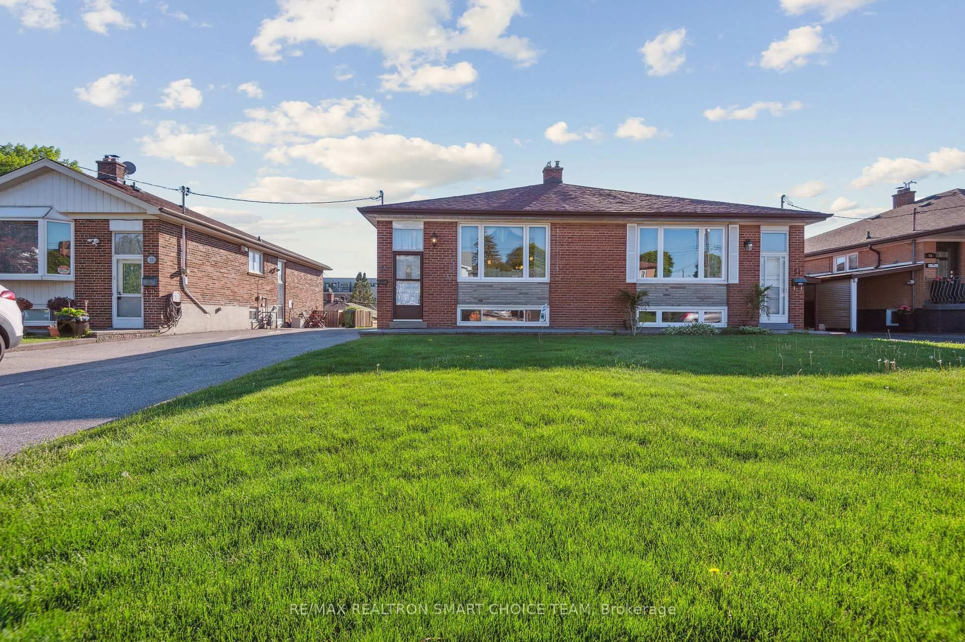 Home with brick exterior material, street for 52 Pinebrook Ave, Toronto Ontario M4A 1Z2
