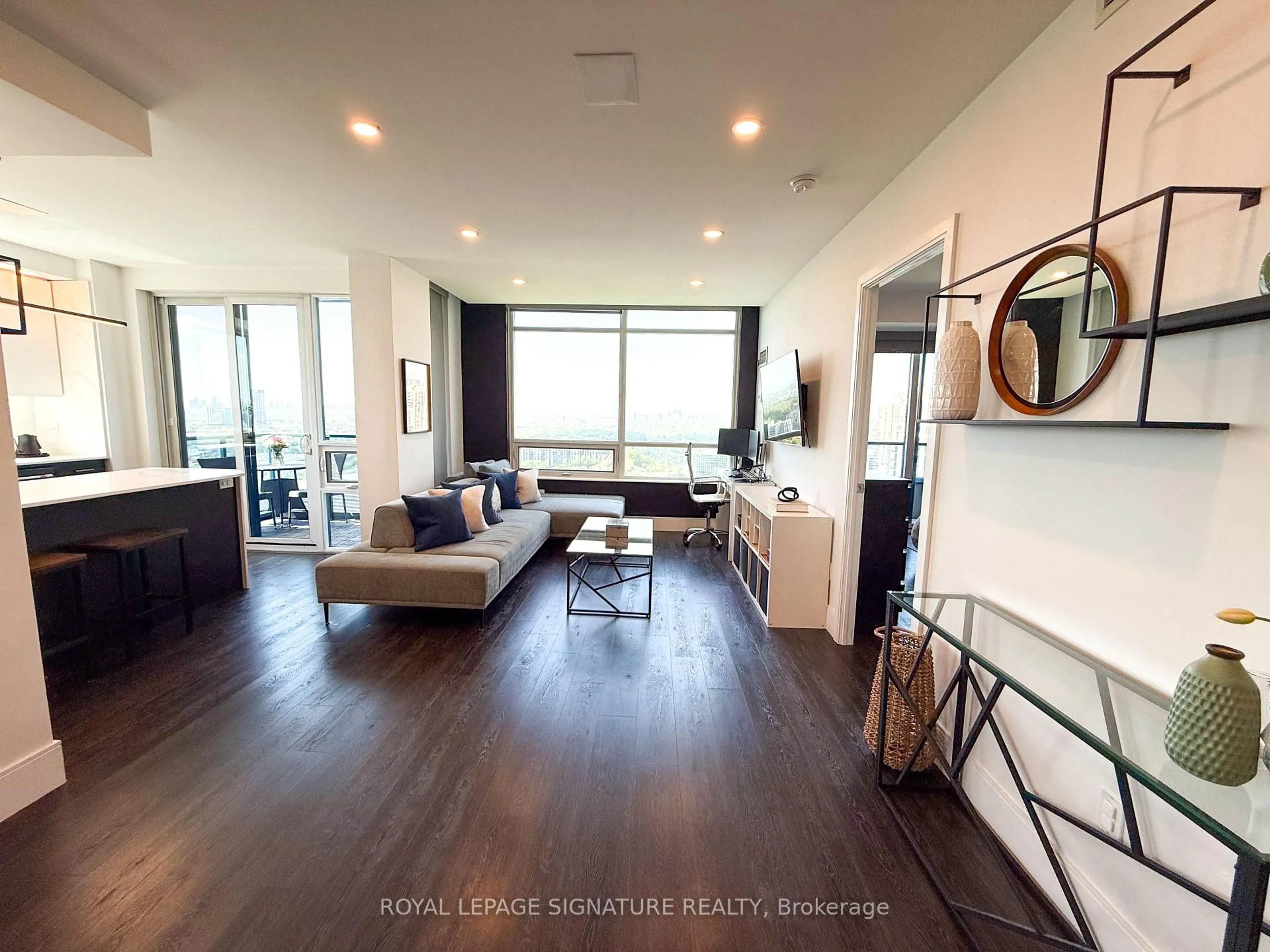 Living room with furniture, wood/laminate floor for 181 Wynford Dr #2607, Toronto Ontario M3C 0C6