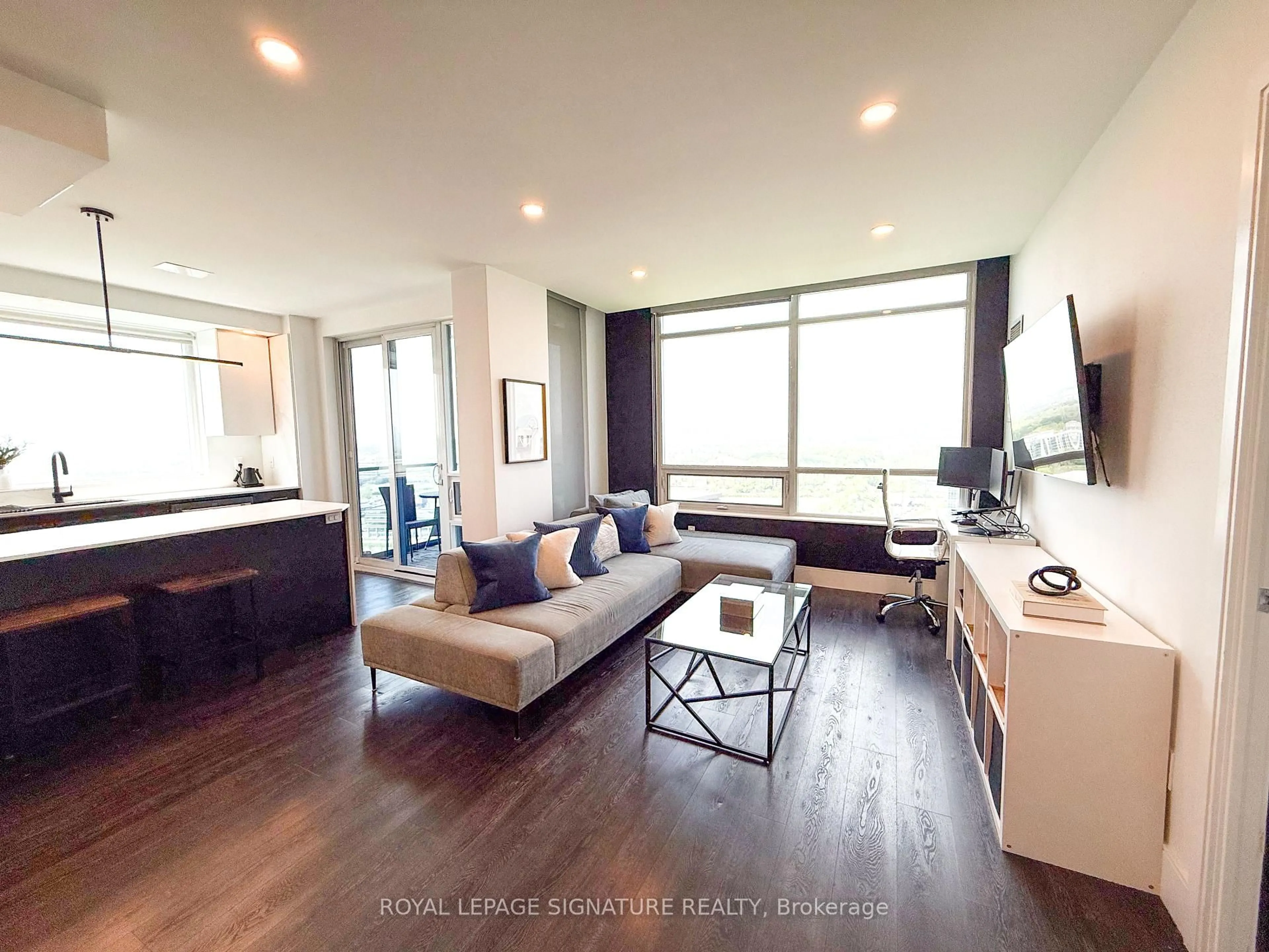 Living room with furniture, wood/laminate floor for 181 Wynford Dr #2607, Toronto Ontario M3C 0C6