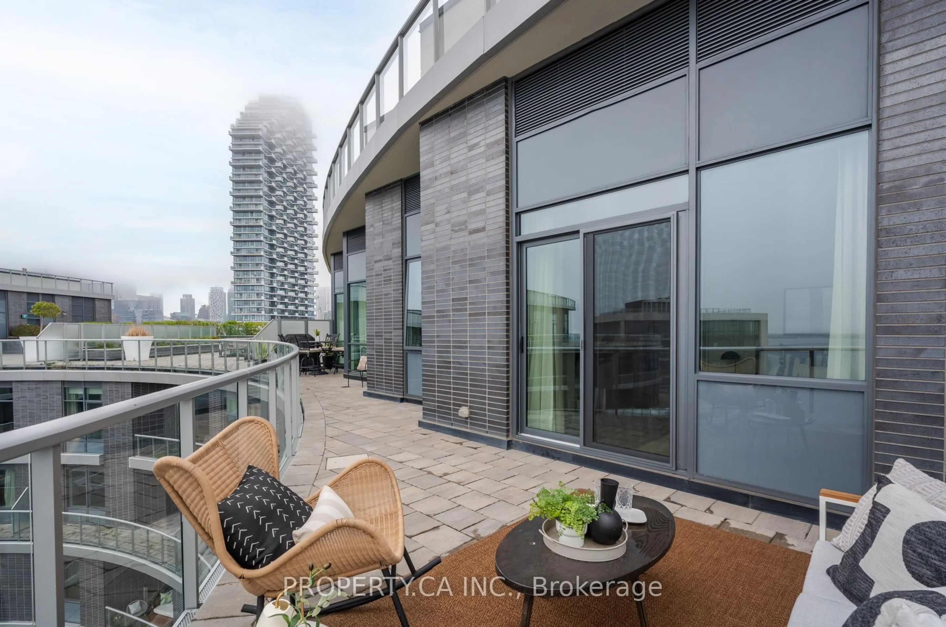 Patio, city buildings view from balcony for 1 Edgewater Dr #SPH12, Toronto Ontario M5A 0L1