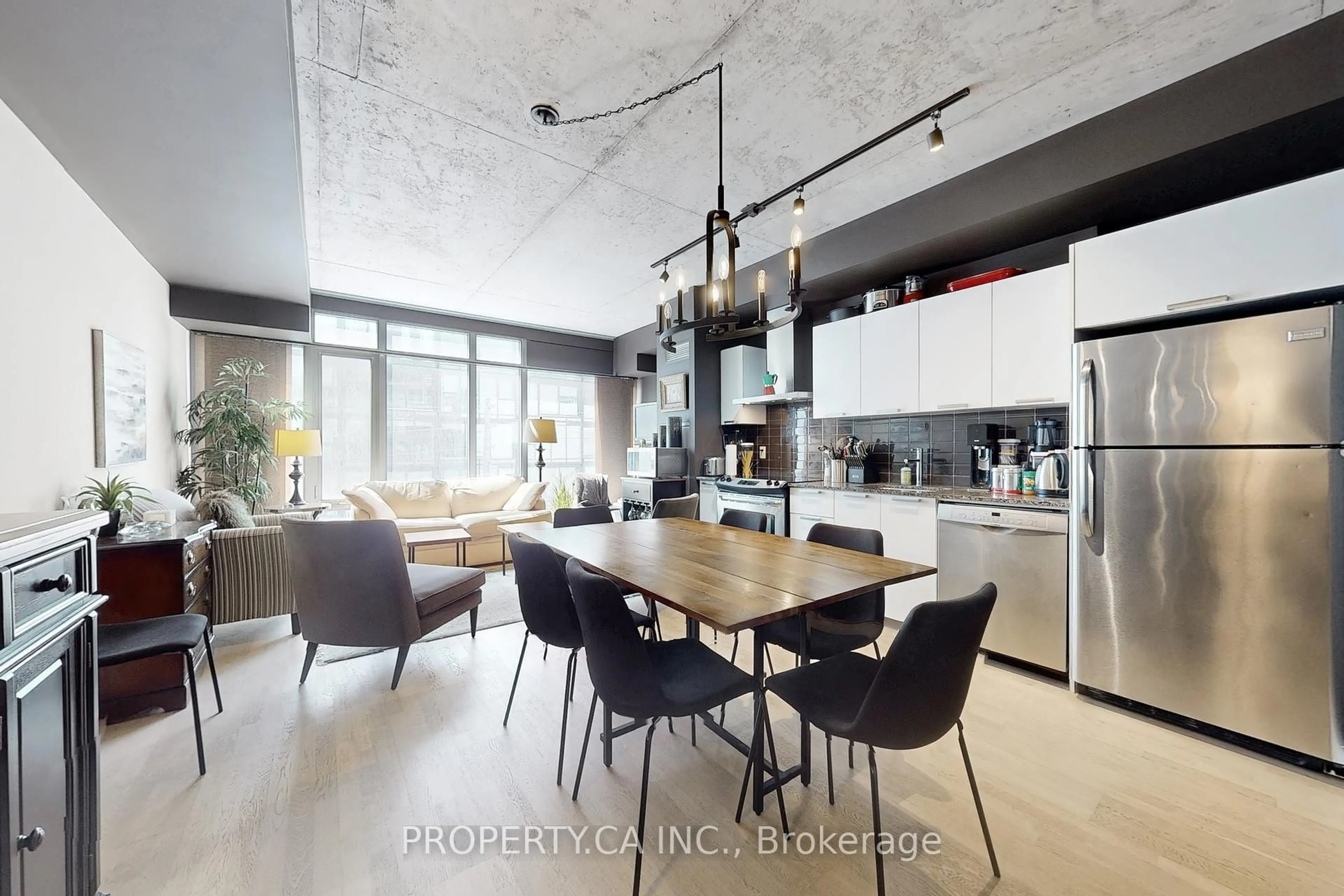 Open concept kitchen, cement floor for 650 King St #413, Toronto Ontario M5V 0H6
