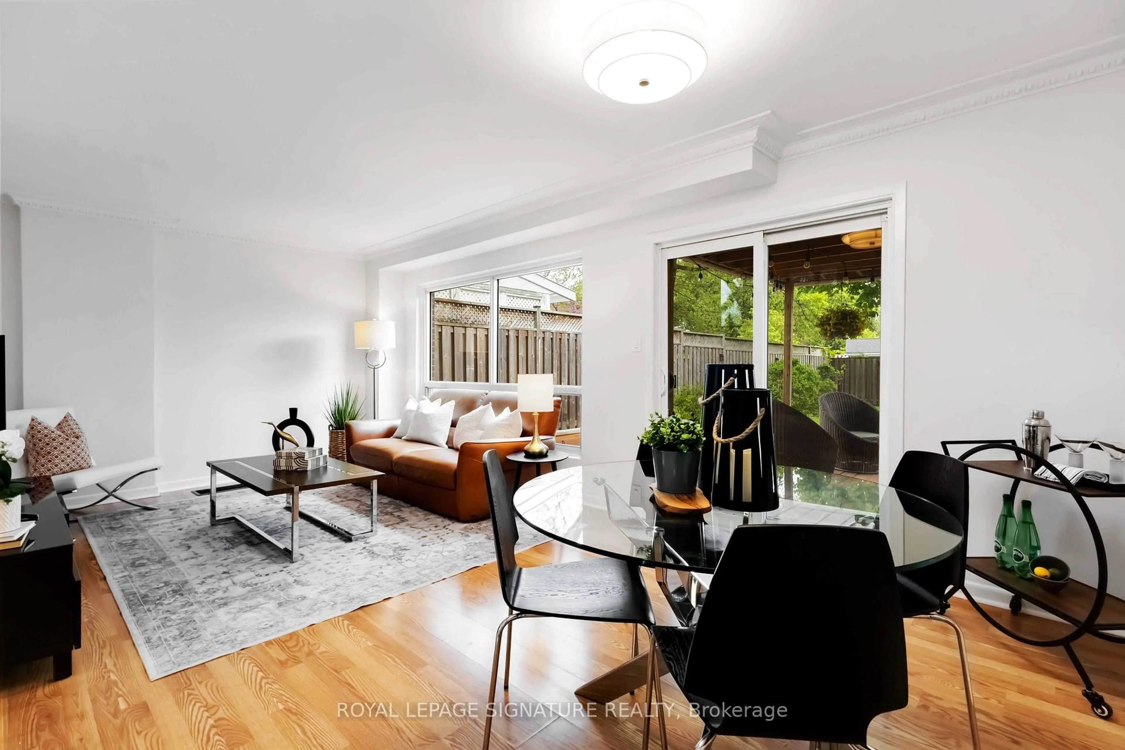 Living room with furniture, wood/laminate floor for 124 Marbury Cres, Toronto Ontario M3A 2G4
