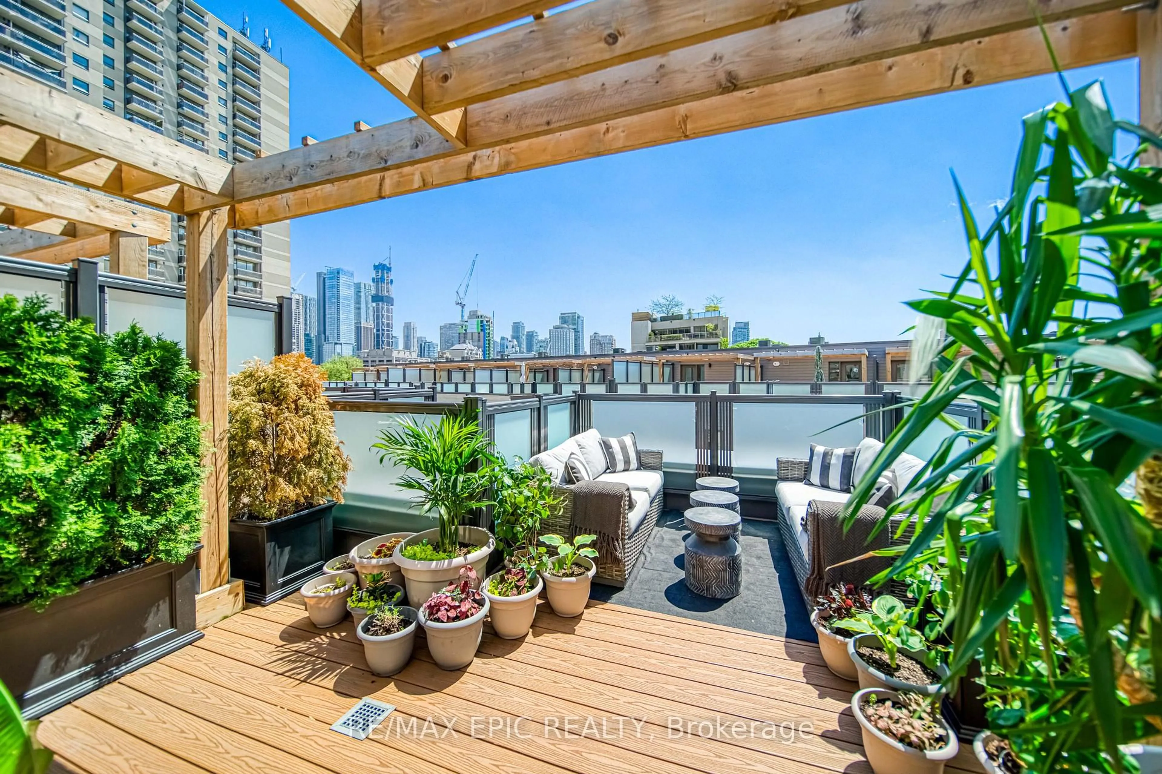 Patio, city buildings view from balcony for 165 Pears Ave #TH16, Toronto Ontario M5R 0C1