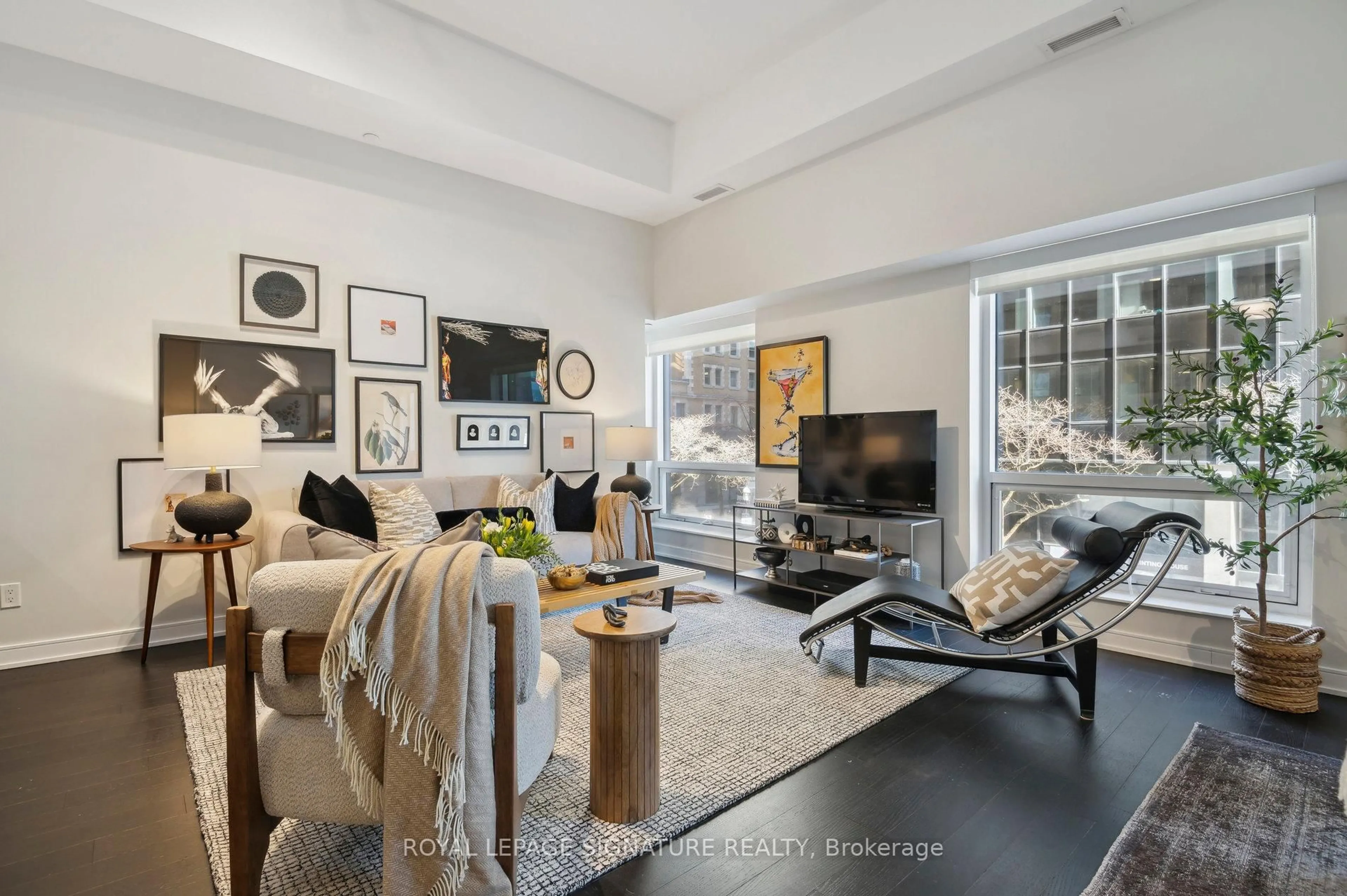 Living room with furniture, unknown for 88 Scott St #210, Toronto Ontario M5E 0A9