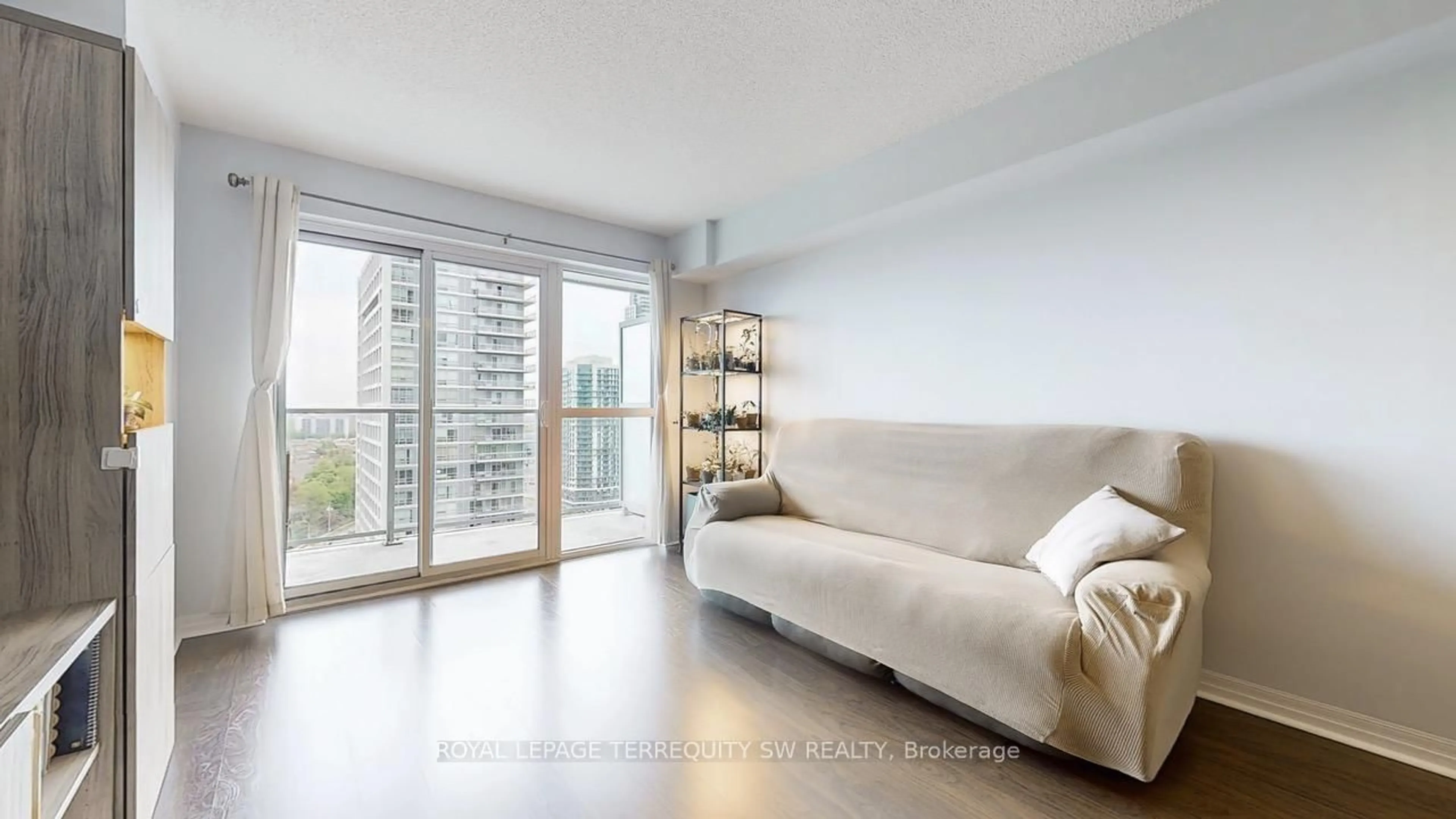 Living room with furniture, wood/laminate floor for 275 Yorkland Rd #1905, Toronto Ontario M2J 0B4