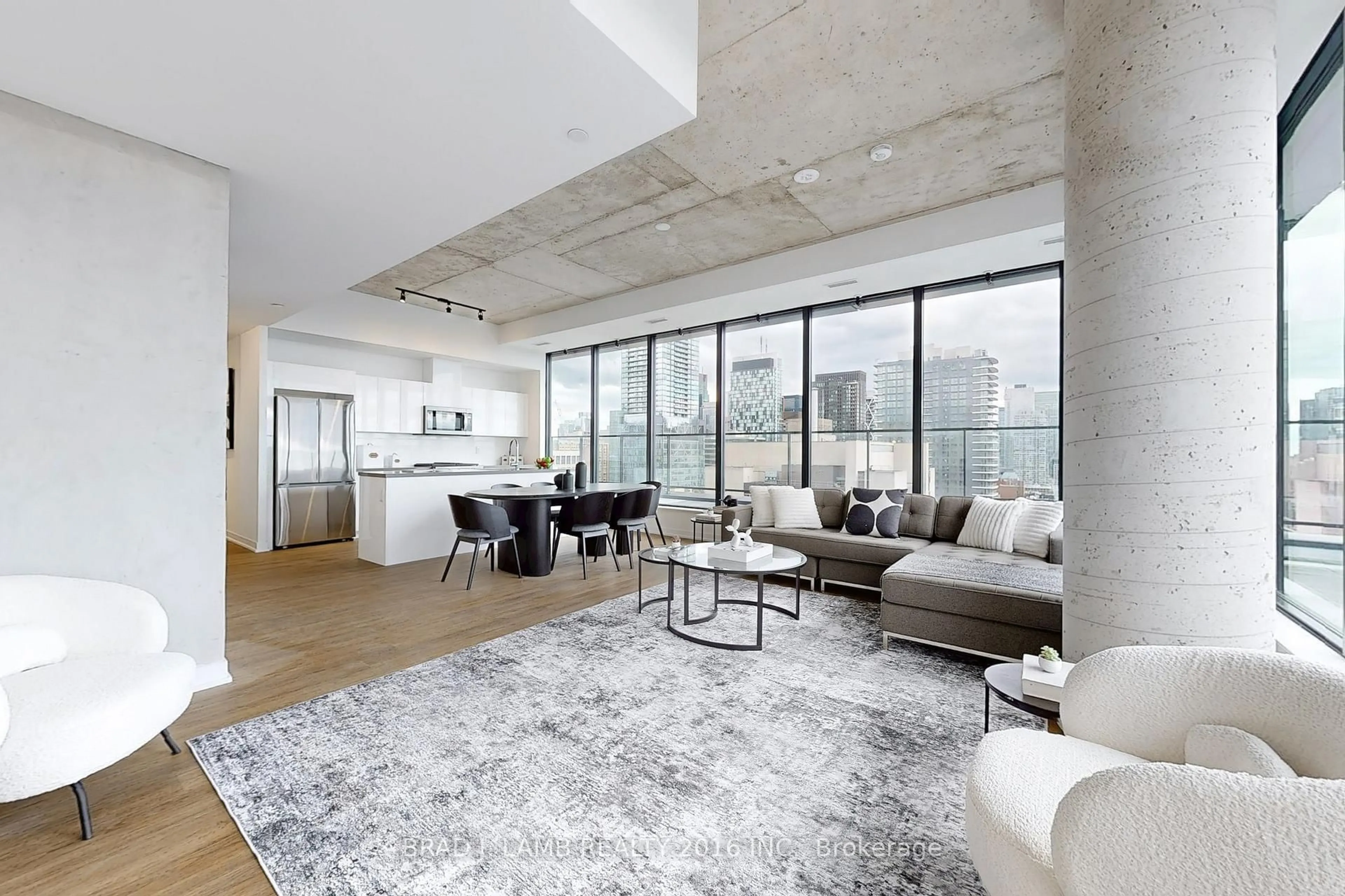 Living room with furniture, cement floor for 195 McCaul St #2002, Toronto Ontario M5T 0E5