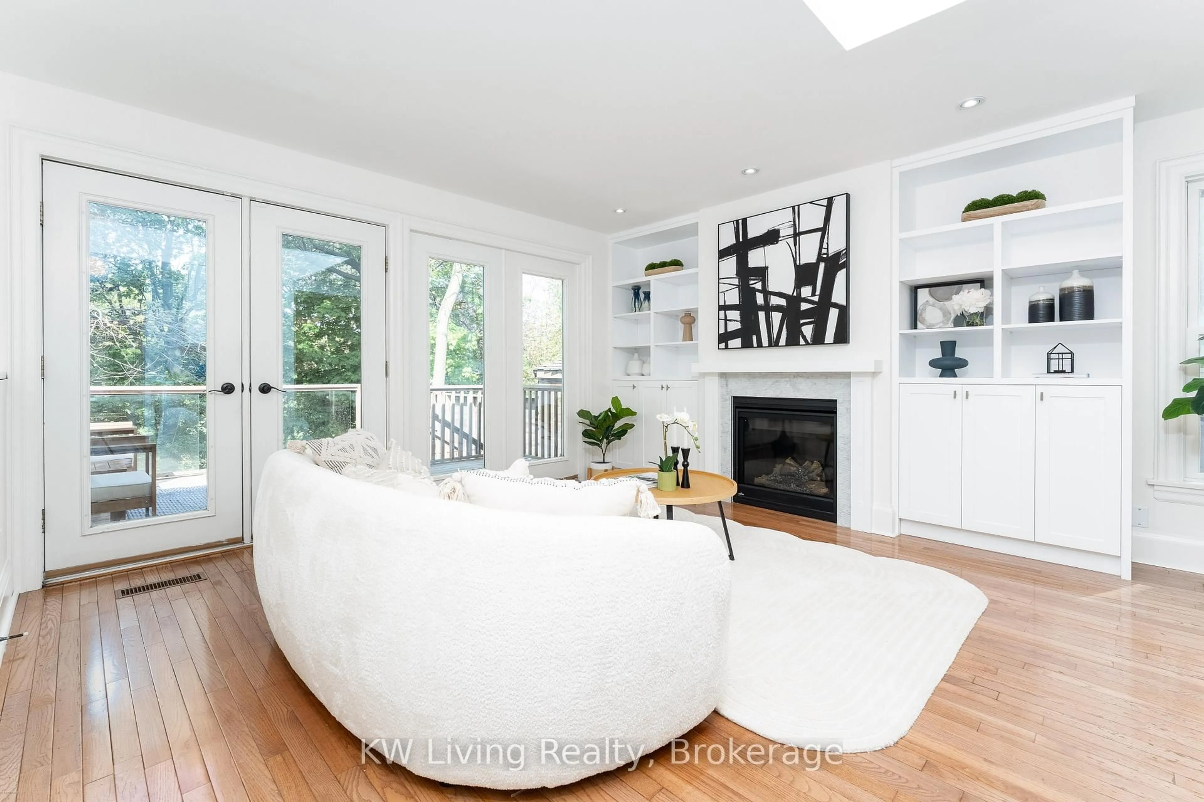 Living room with furniture, wood/laminate floor for 96 Edith Dr, Toronto Ontario M4R 1Z2
