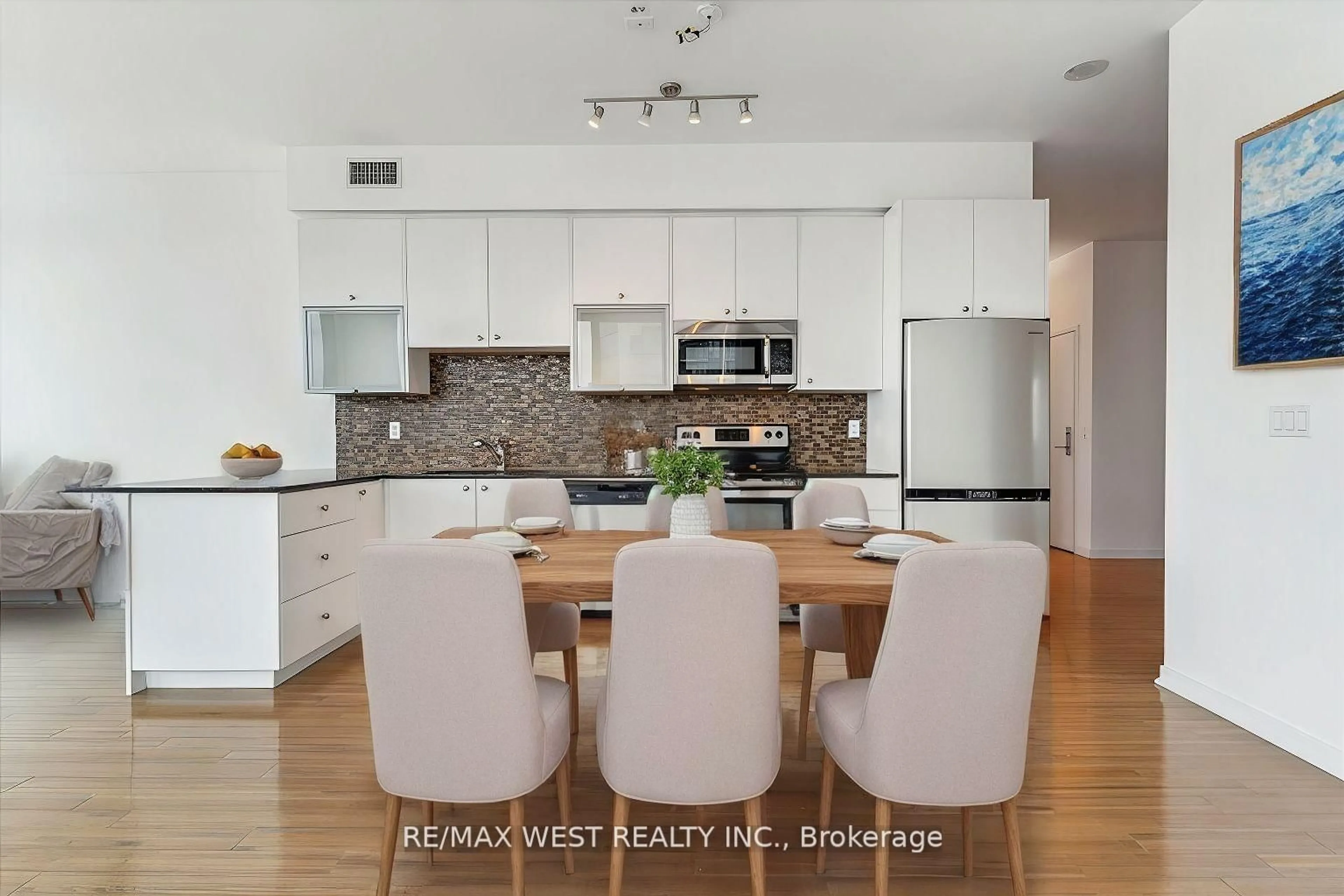 Open concept kitchen, wood/laminate floor for 59 East LIberty St #2302, Toronto Ontario M6K 3R1