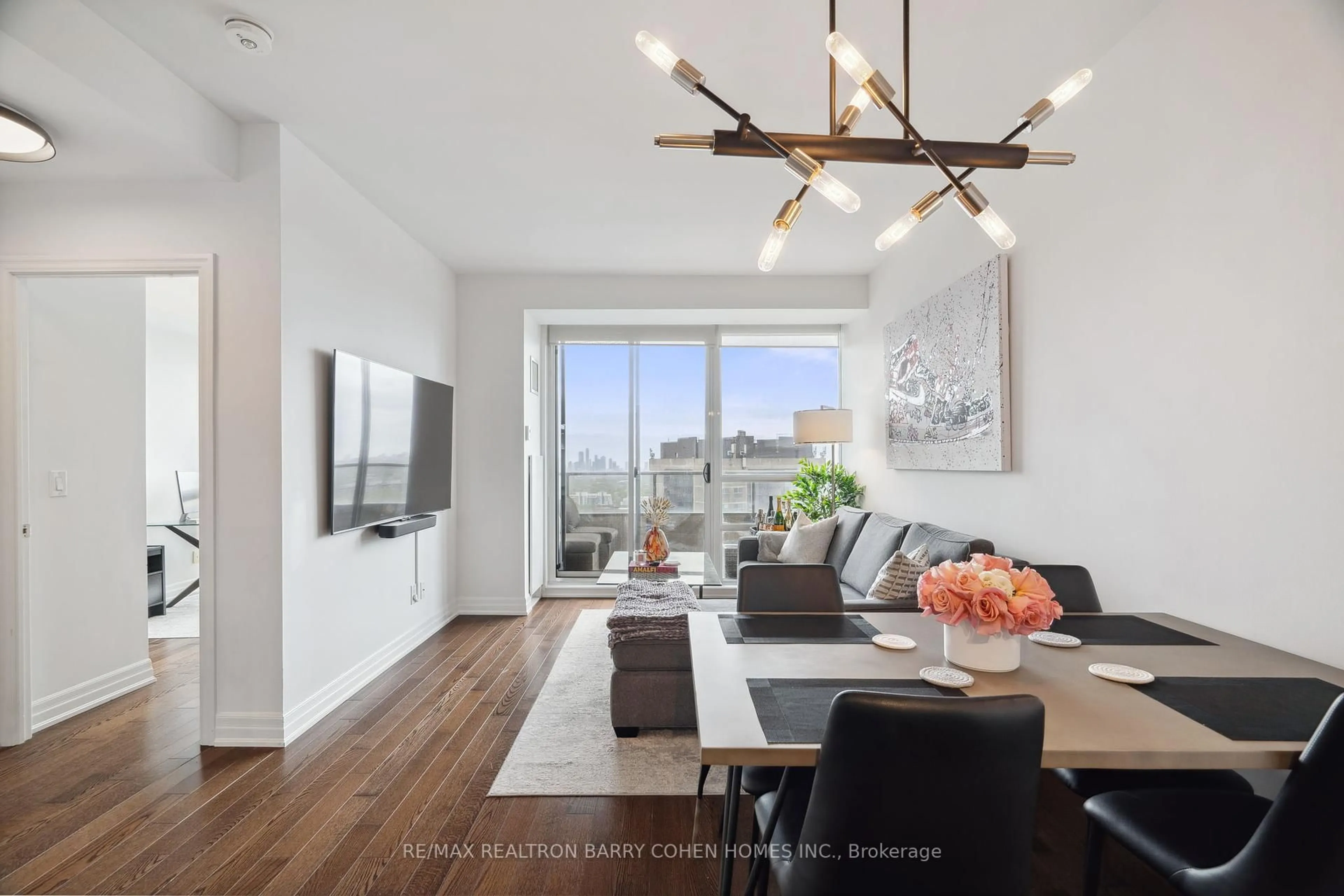 Living room with furniture, wood/laminate floor for 500 St Clair Ave #2007, Toronto Ontario M6C 1A8