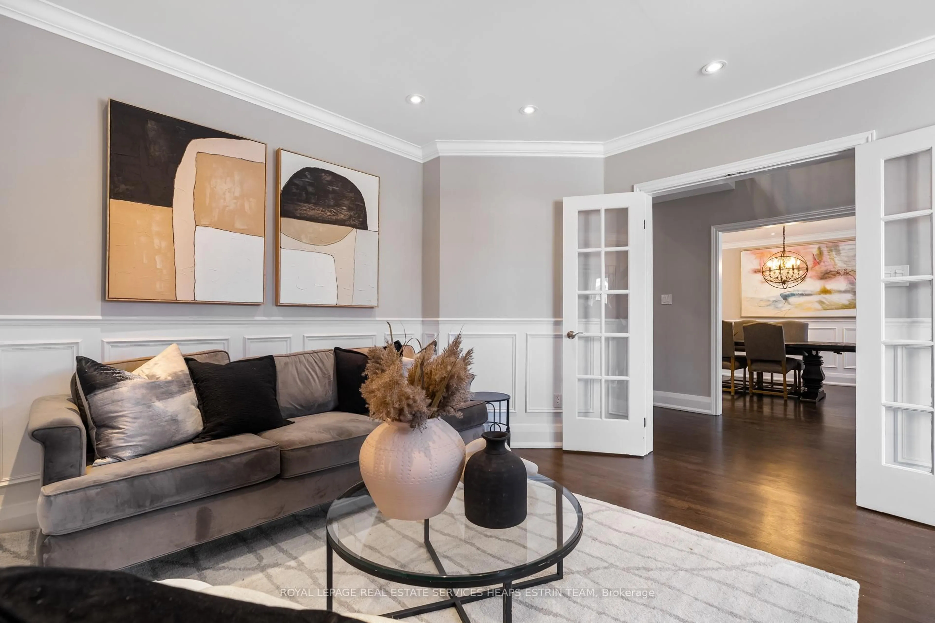Living room with furniture, wood/laminate floor for 27 Wilberton Rd, Toronto Ontario M4V 1Z2