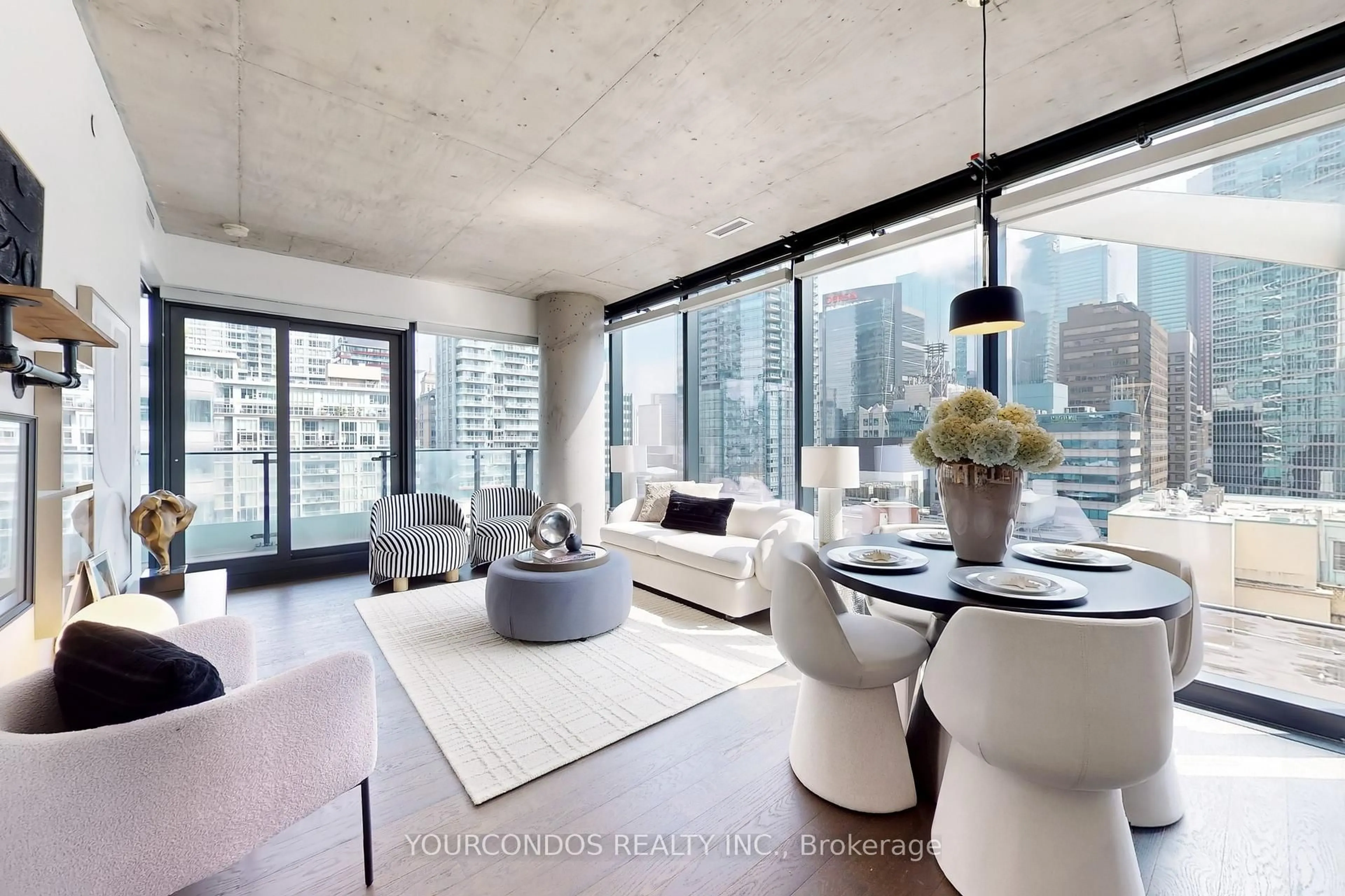 Living room with furniture, cement floor for 224 King St #1003, Toronto Ontario M5H 0A6
