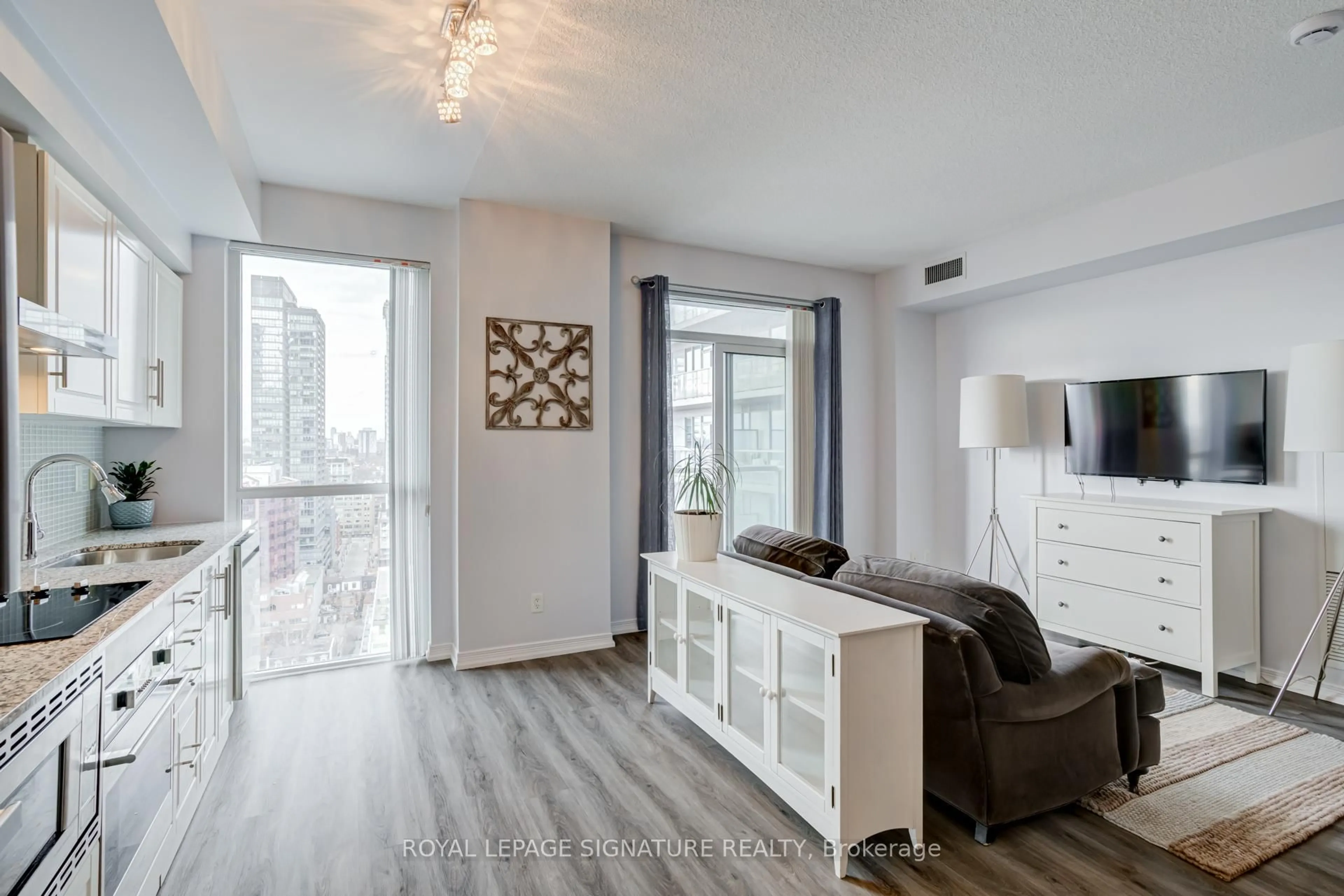 Living room with furniture, wood/laminate floor for 352 Front St #2108, Toronto Ontario M5V 0K3