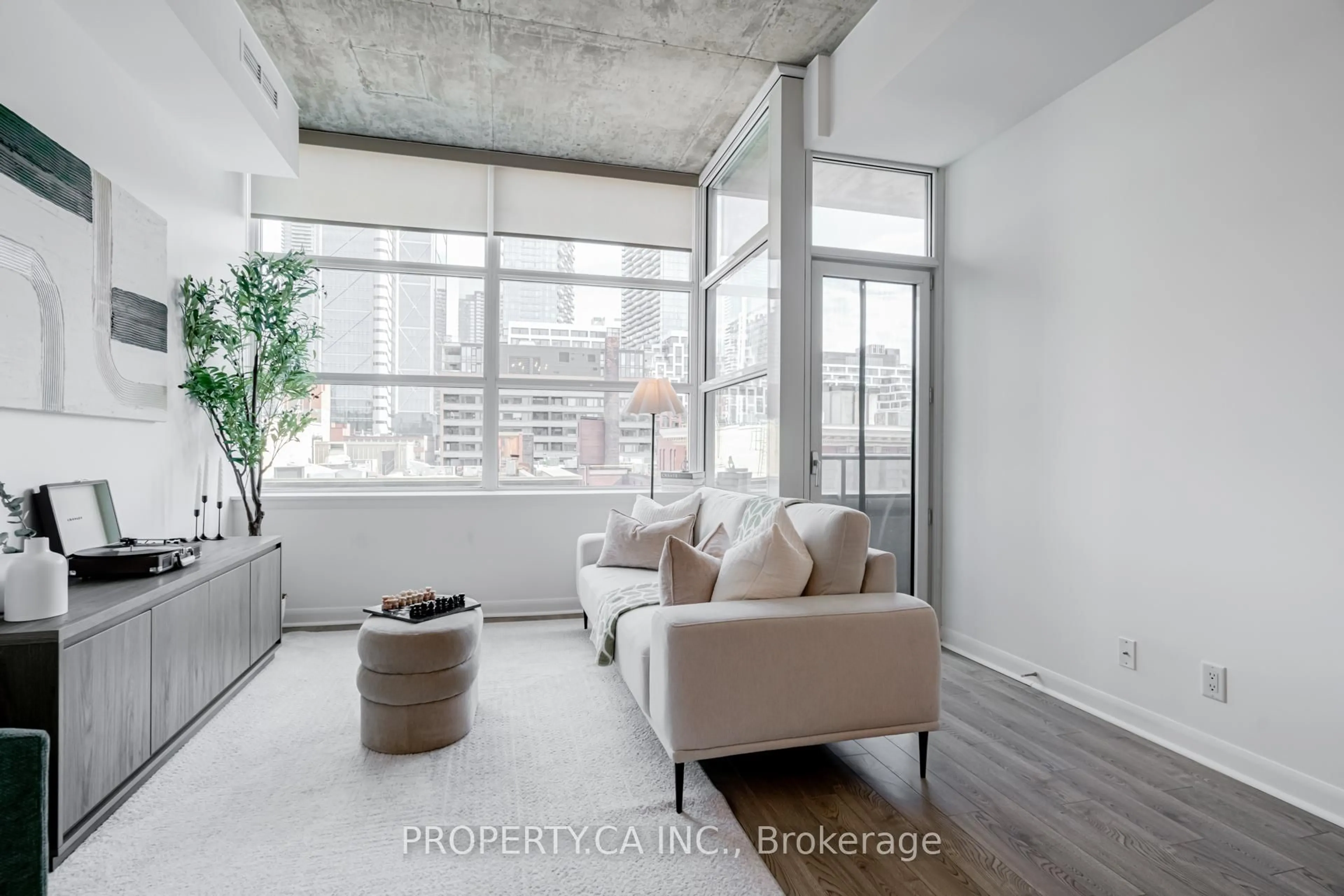 Living room with furniture, cement floor for 478 King St #509, Toronto Ontario M5V 0A8