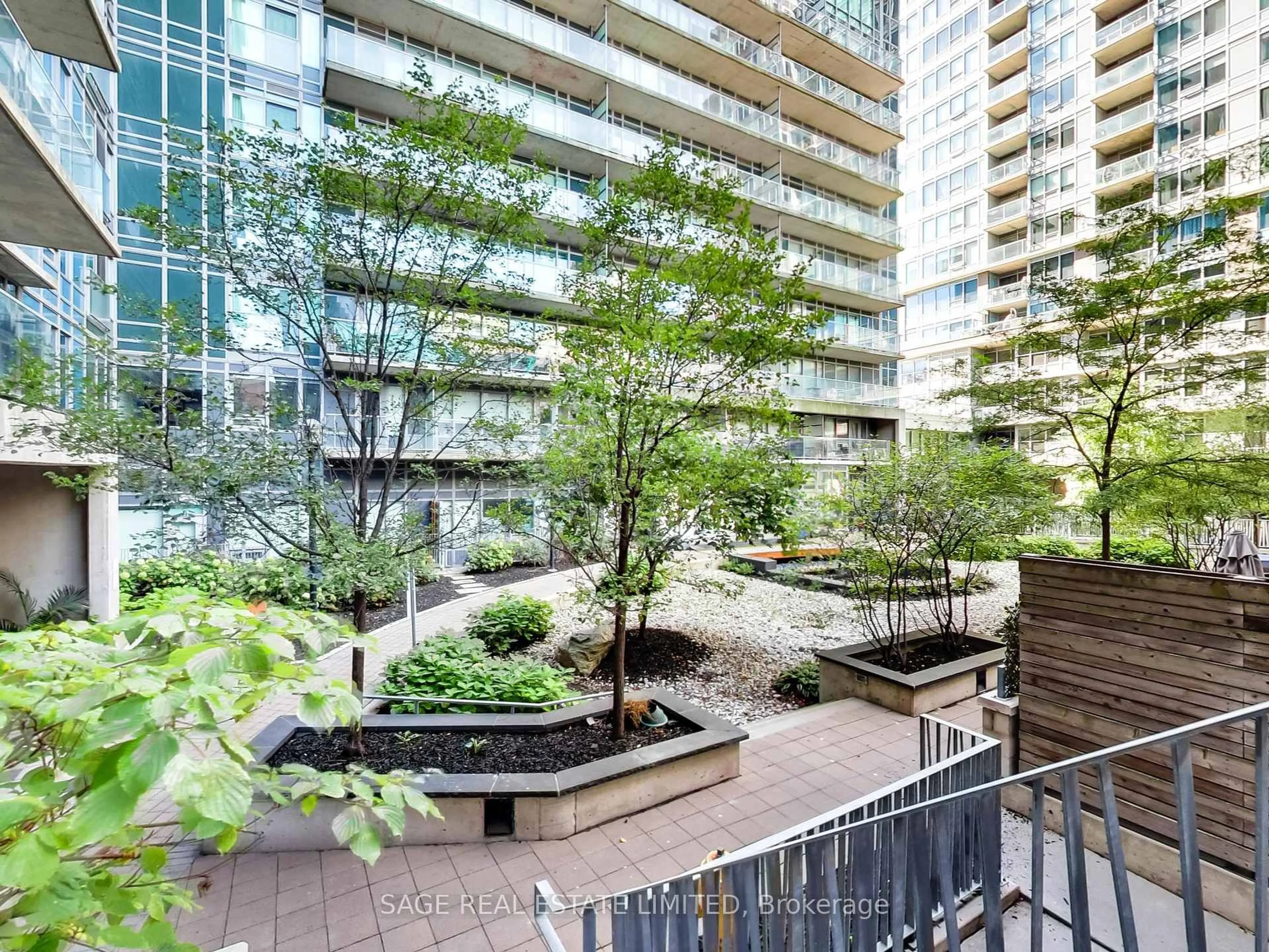 Patio, city buildings view from balcony for 57 East Liberty St #214, Toronto Ontario M6K 3P5