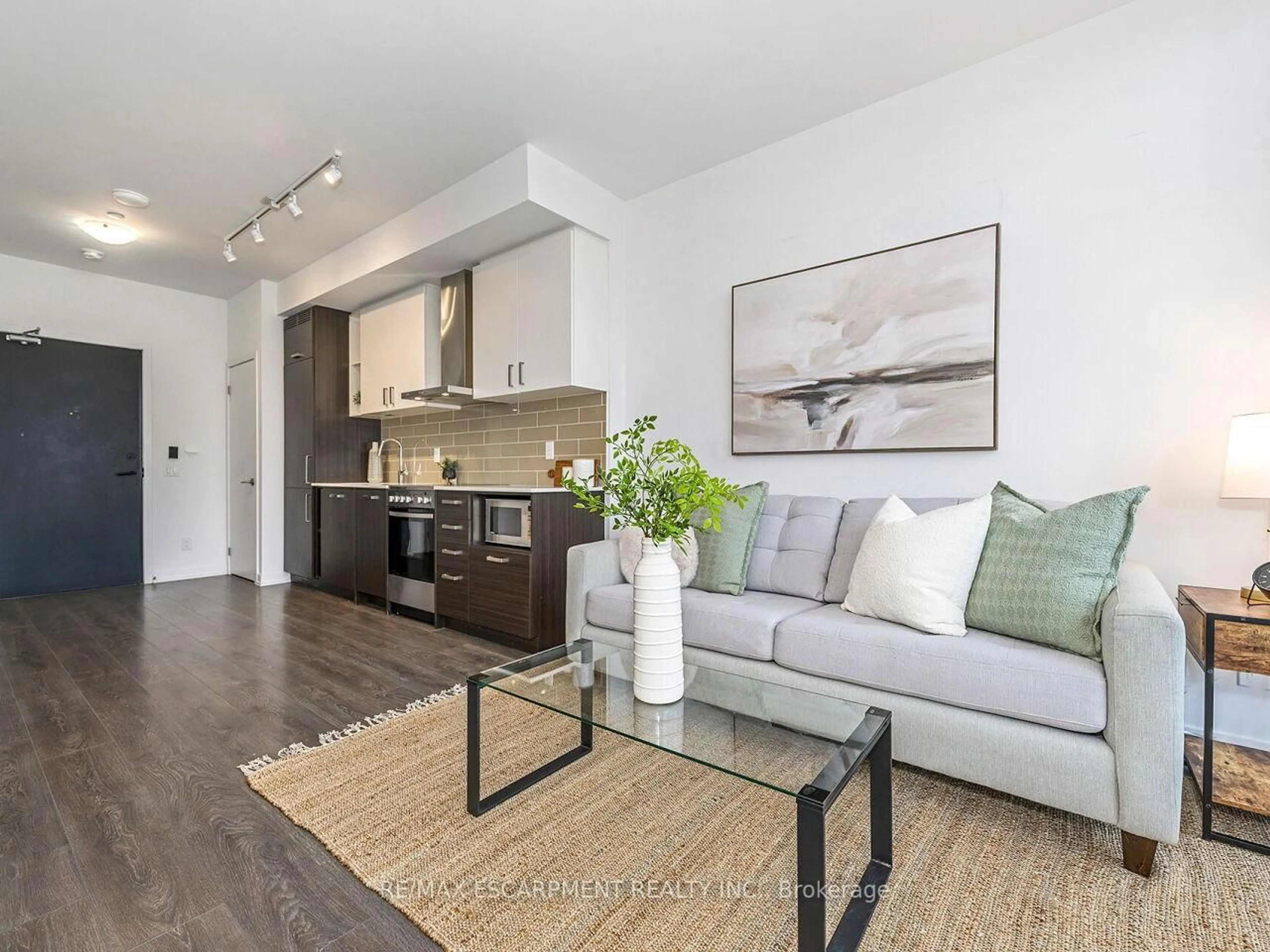 Living room with furniture, wood/laminate floor for 125 Redpath Ave #PH 104, Toronto Ontario M4S 0B5