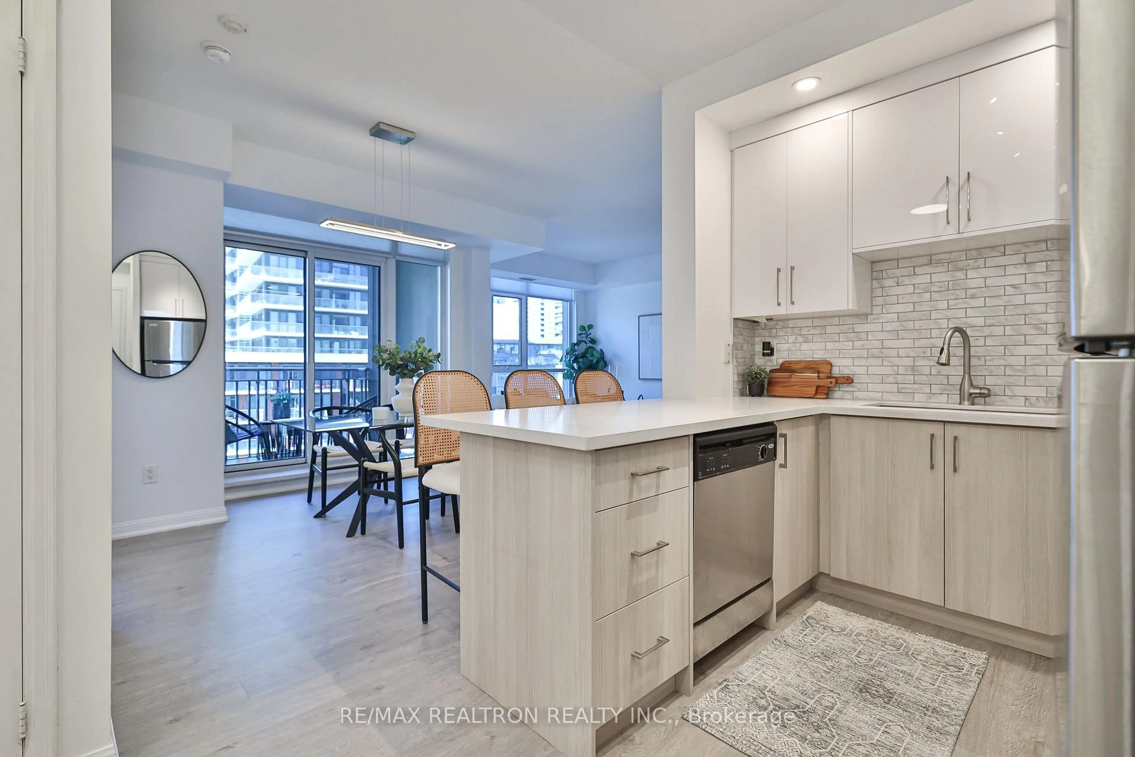 Open concept kitchen, ceramic/tile floor for 21 Grand Magazine St #710, Toronto Ontario M5V 1B5