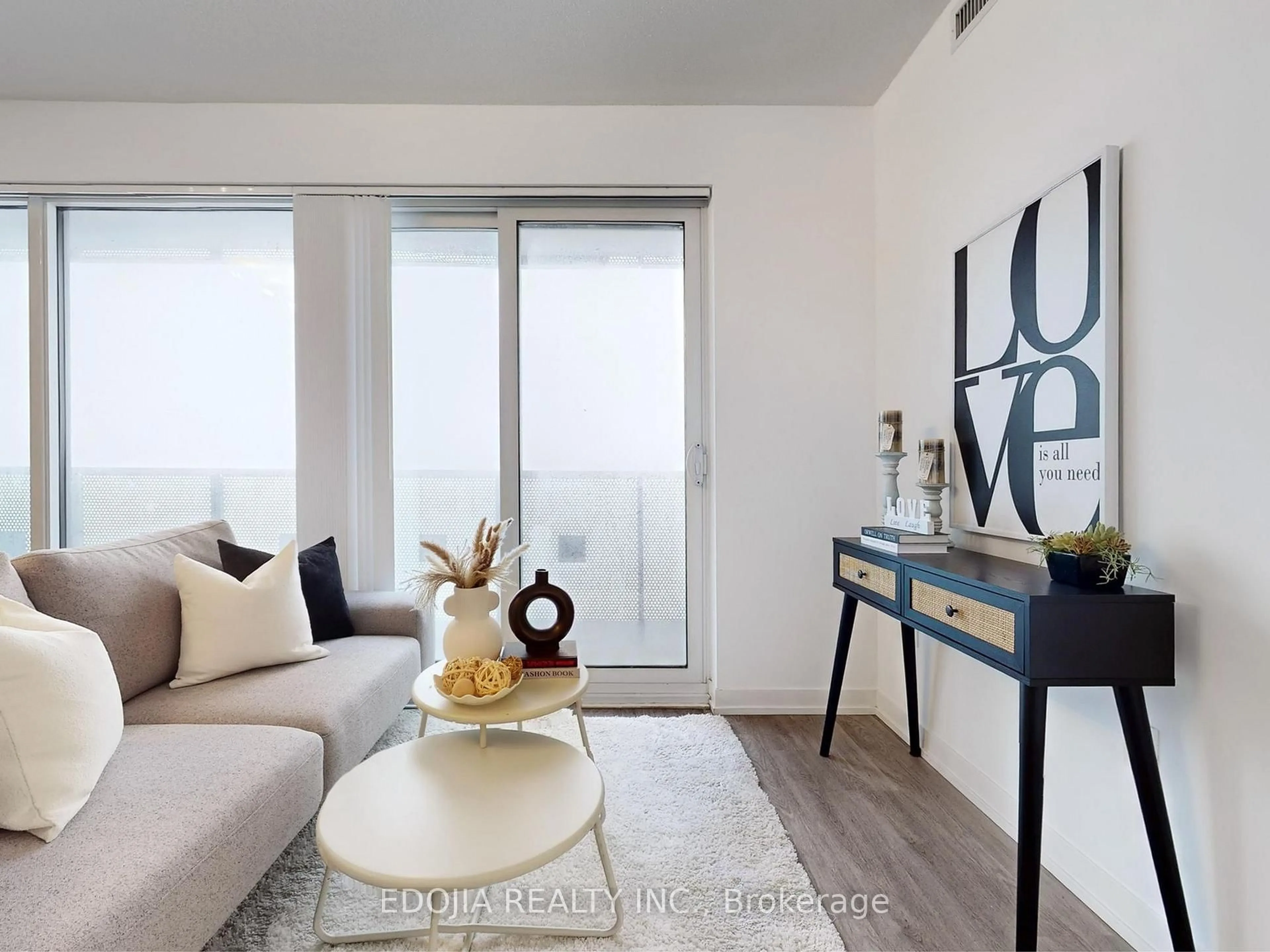 Living room with furniture, wood/laminate floor for 55 Cooper St #4605, Toronto Ontario M5E 0G1