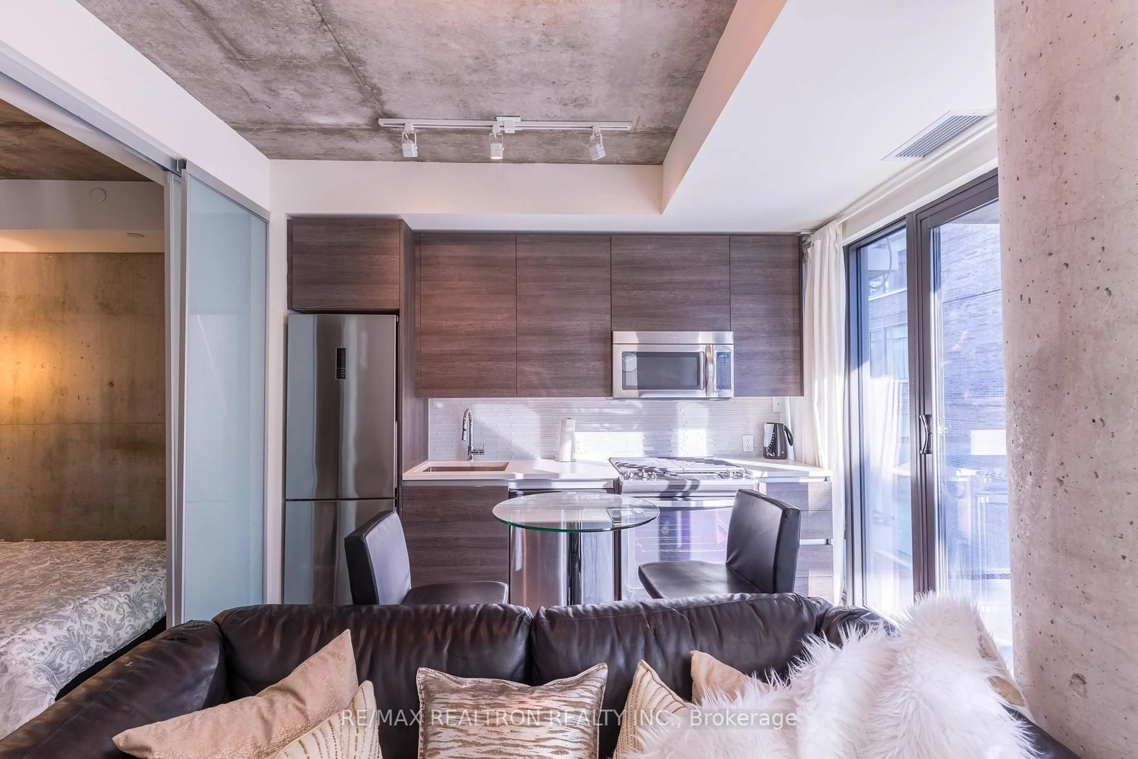 Open concept kitchen, cement floor for 111 Bathurst St #1001, Toronto Ontario M5V 2R1