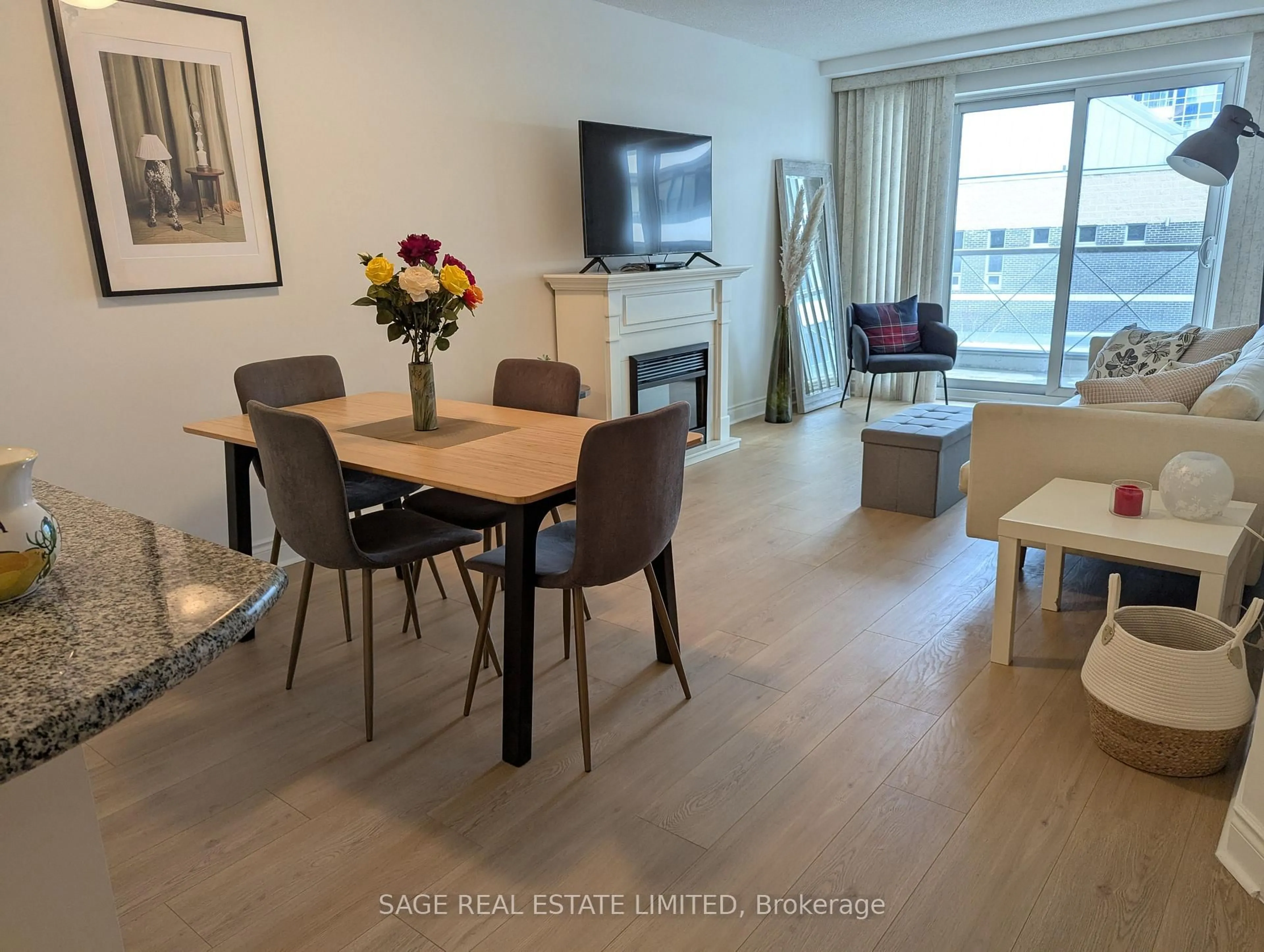 Living room with furniture, wood/laminate floor for 12 Rean Dr #307, Toronto Ontario M2K 3C6