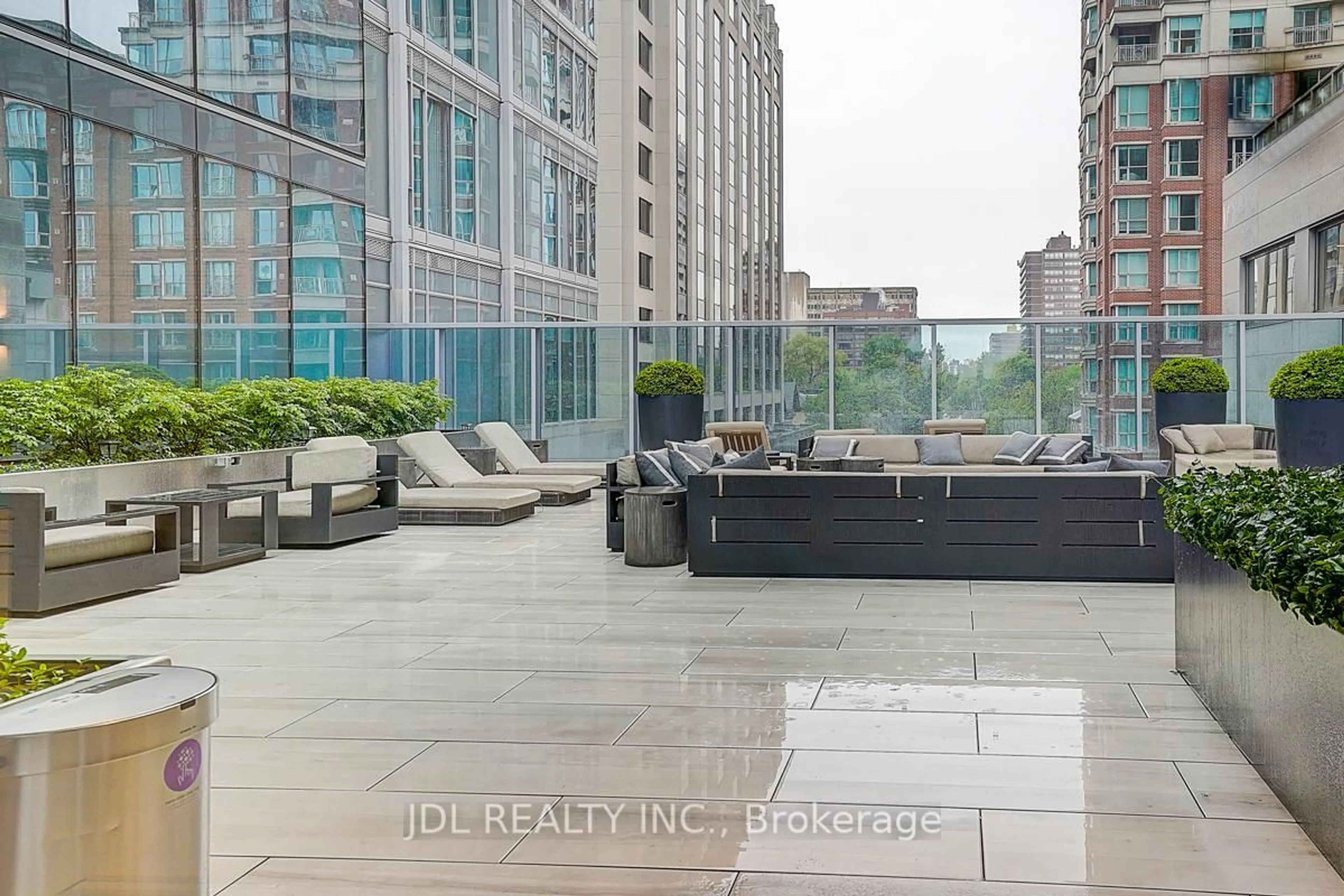 Patio, city buildings view from balcony for 188 Cumberland St #1202, Toronto Ontario M5R 2G3