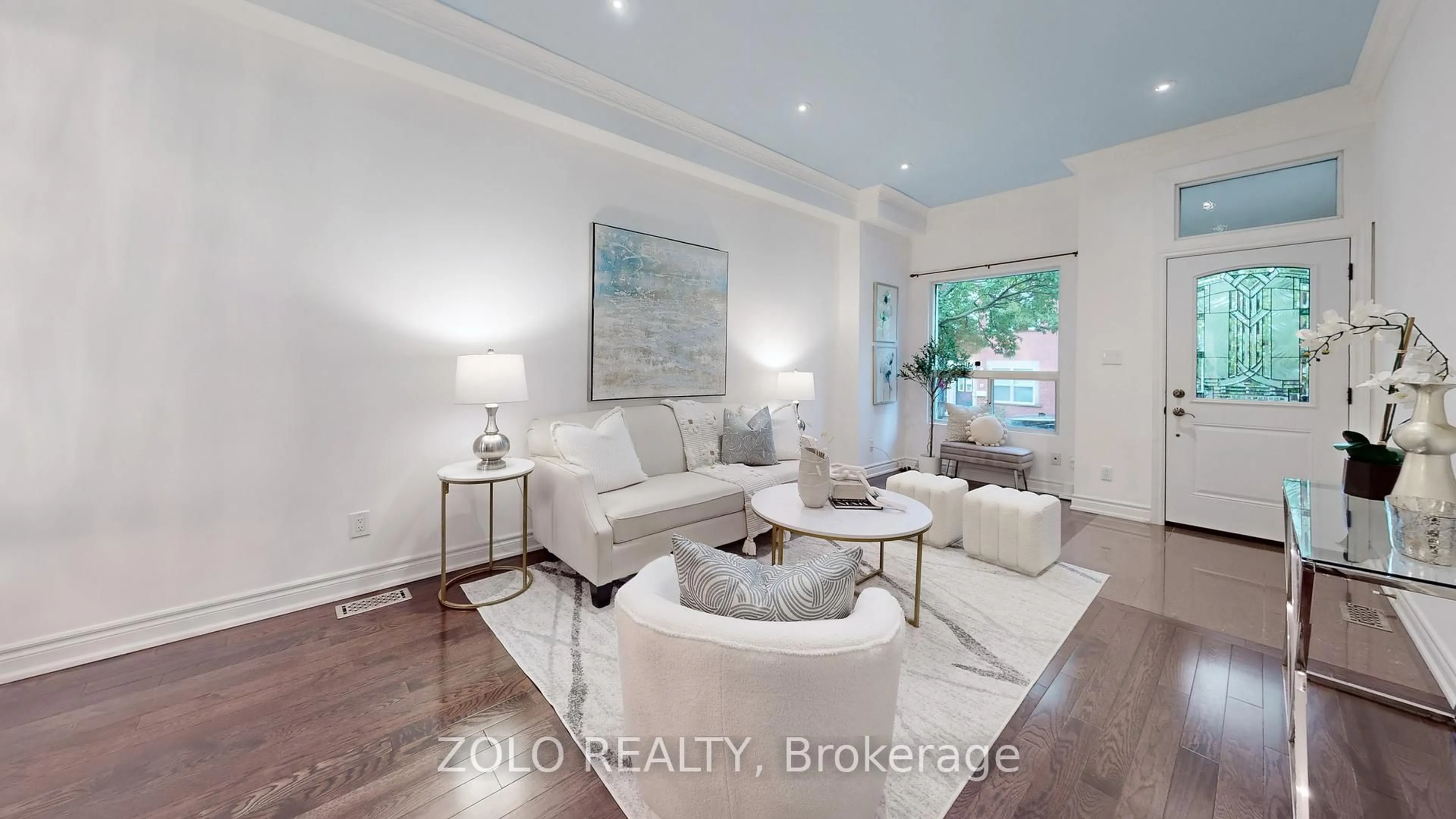 Living room with furniture, wood/laminate floor for 10 Mitchell Ave, Toronto Ontario M6J 1B9