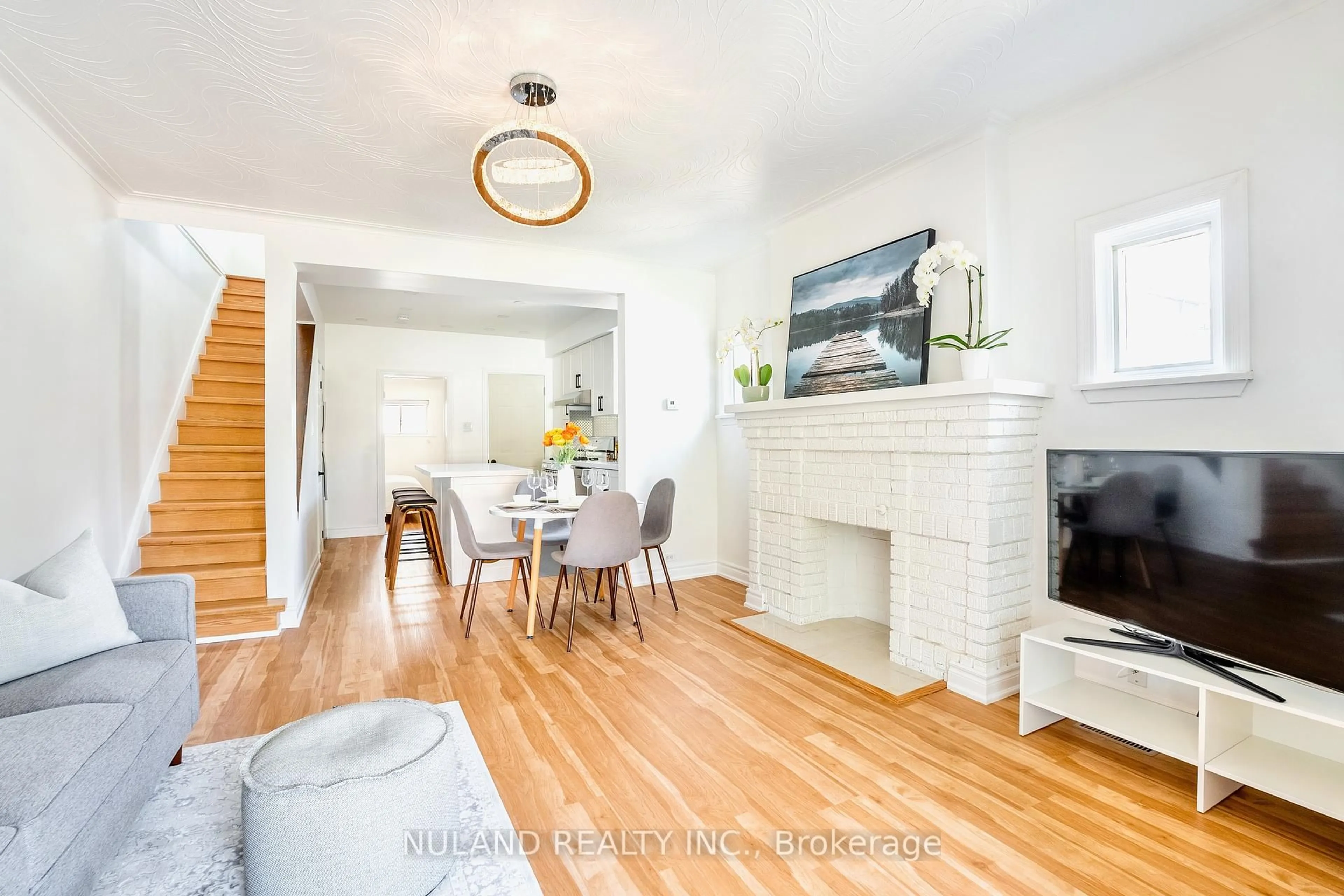 Living room with furniture, wood/laminate floor for 56 Blandford St, Toronto Ontario M6E 3A7