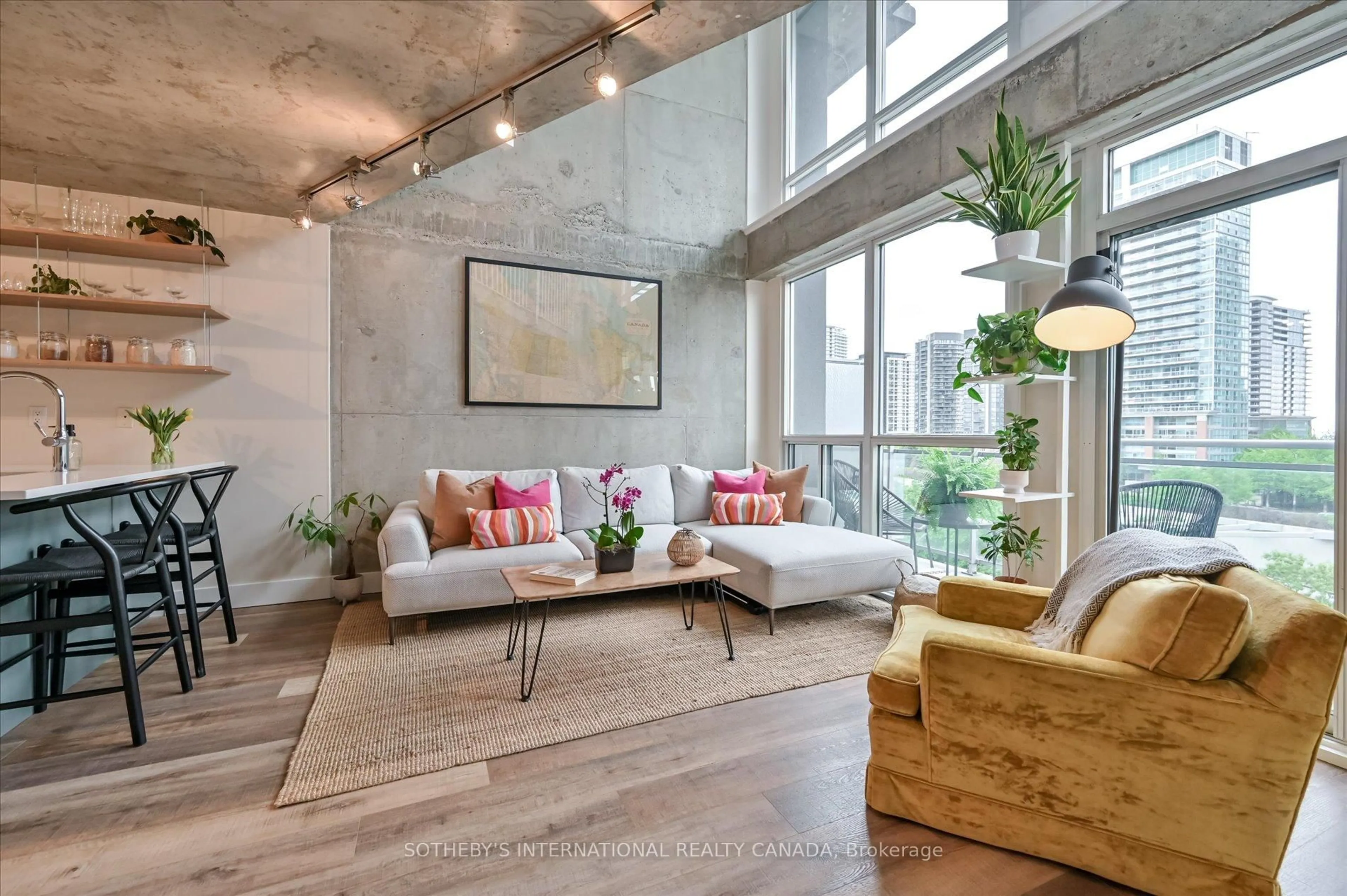 Living room with furniture, cement floor for 1029 King St #602, Toronto Ontario M6K 3M9