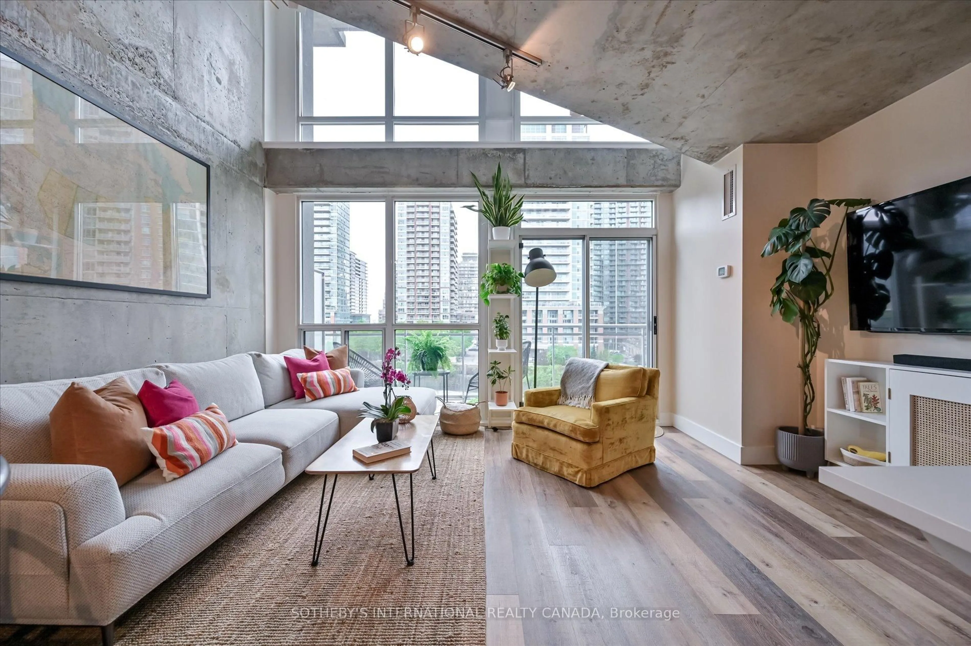 Living room with furniture, cement floor for 1029 King St #602, Toronto Ontario M6K 3M9