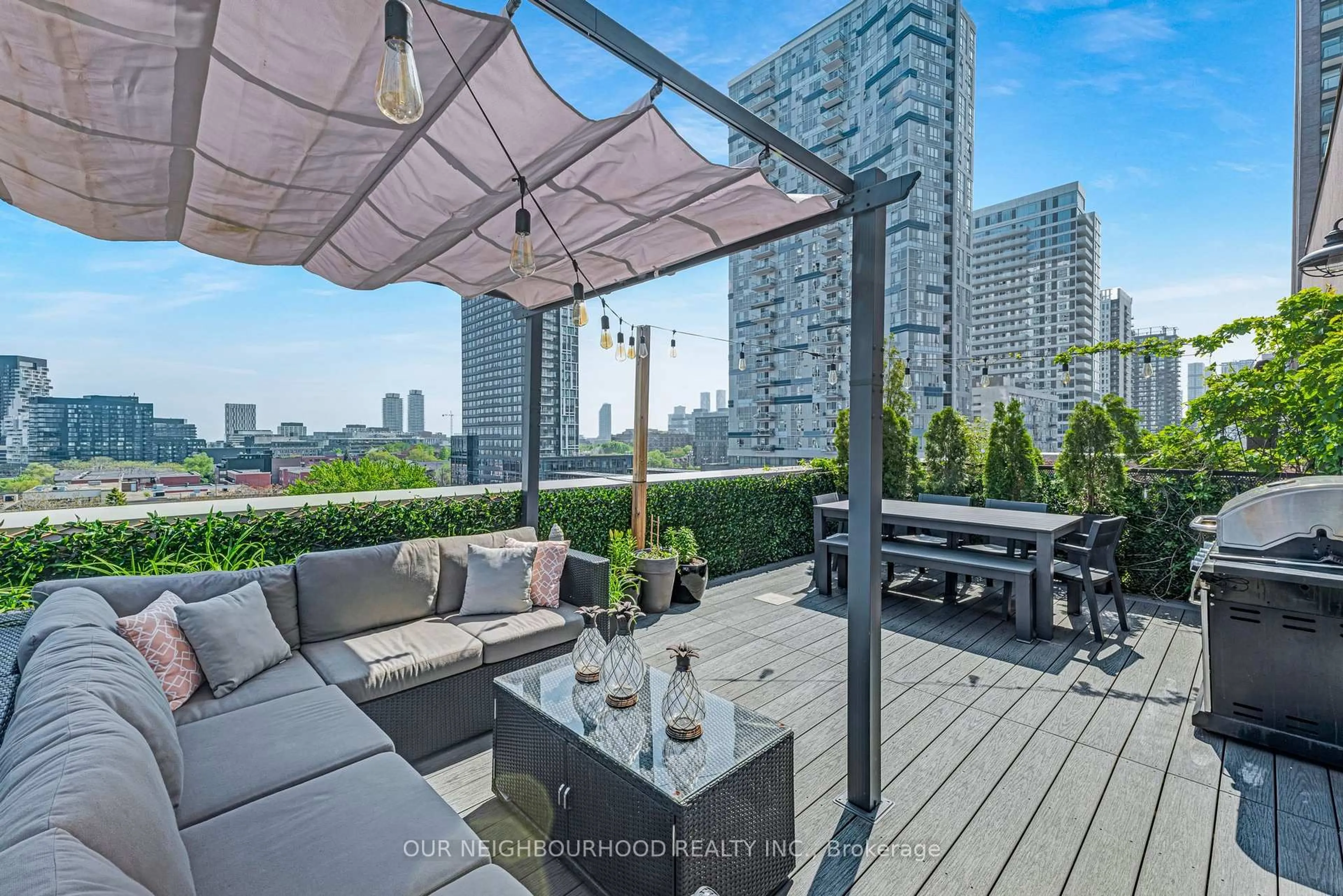 Patio, city buildings view from balcony for 736 Dundas St #PH2, Toronto Ontario M5A 2C5