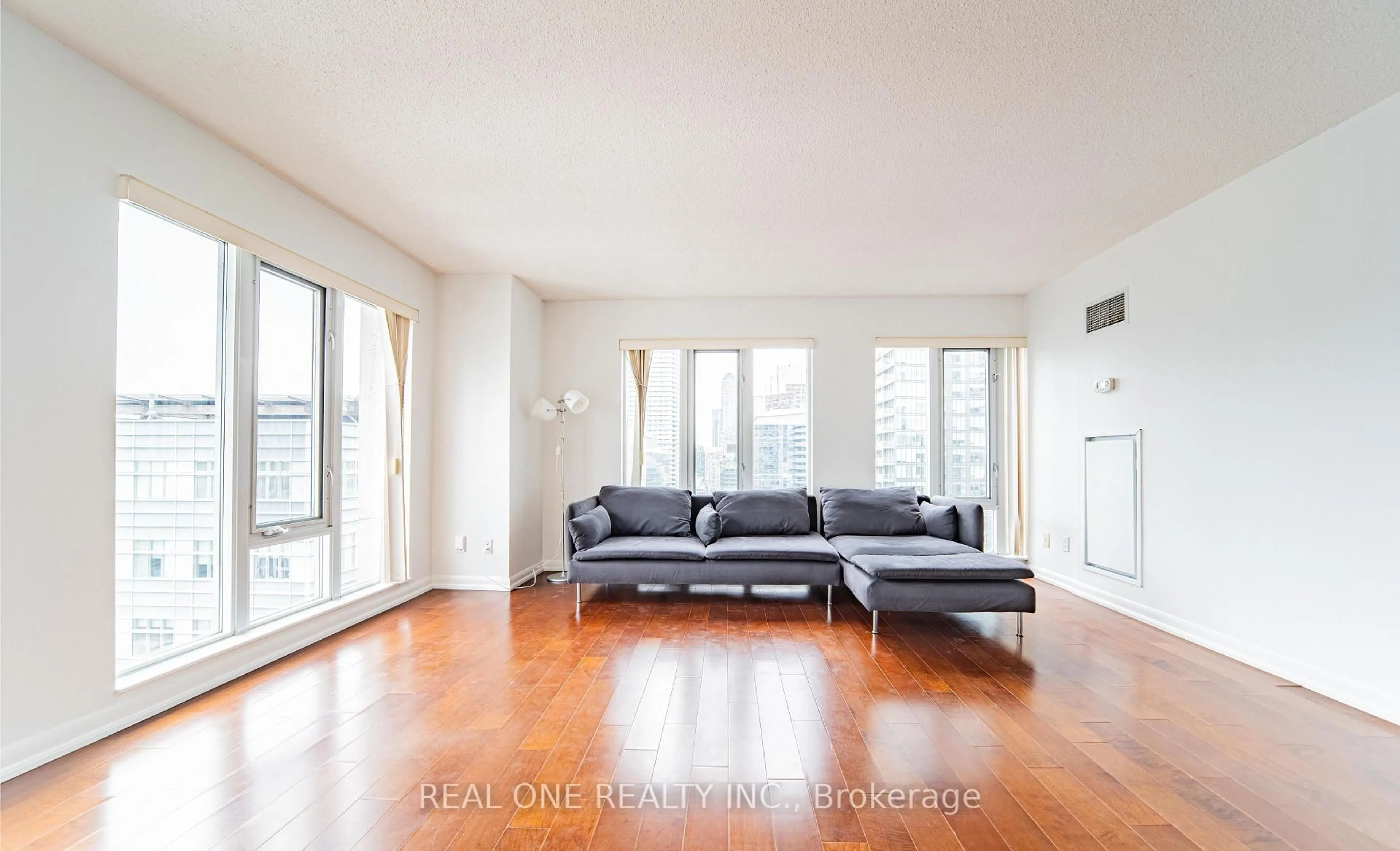 Living room with furniture, wood/laminate floor for 210 Victoria St #2404, Toronto Ontario M5B 2R3