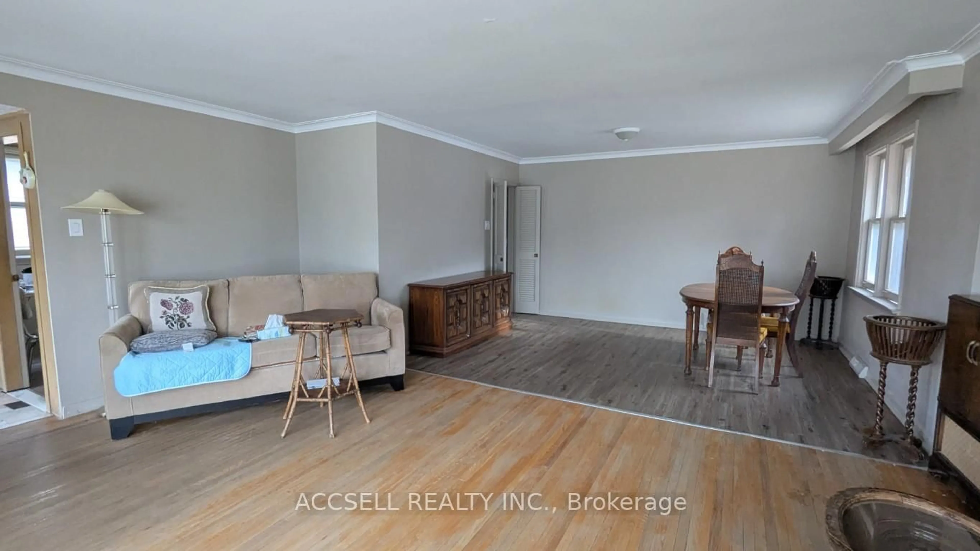 Living room with furniture, wood/laminate floor for 117 Palm Dr, Toronto Ontario M3H 2C2