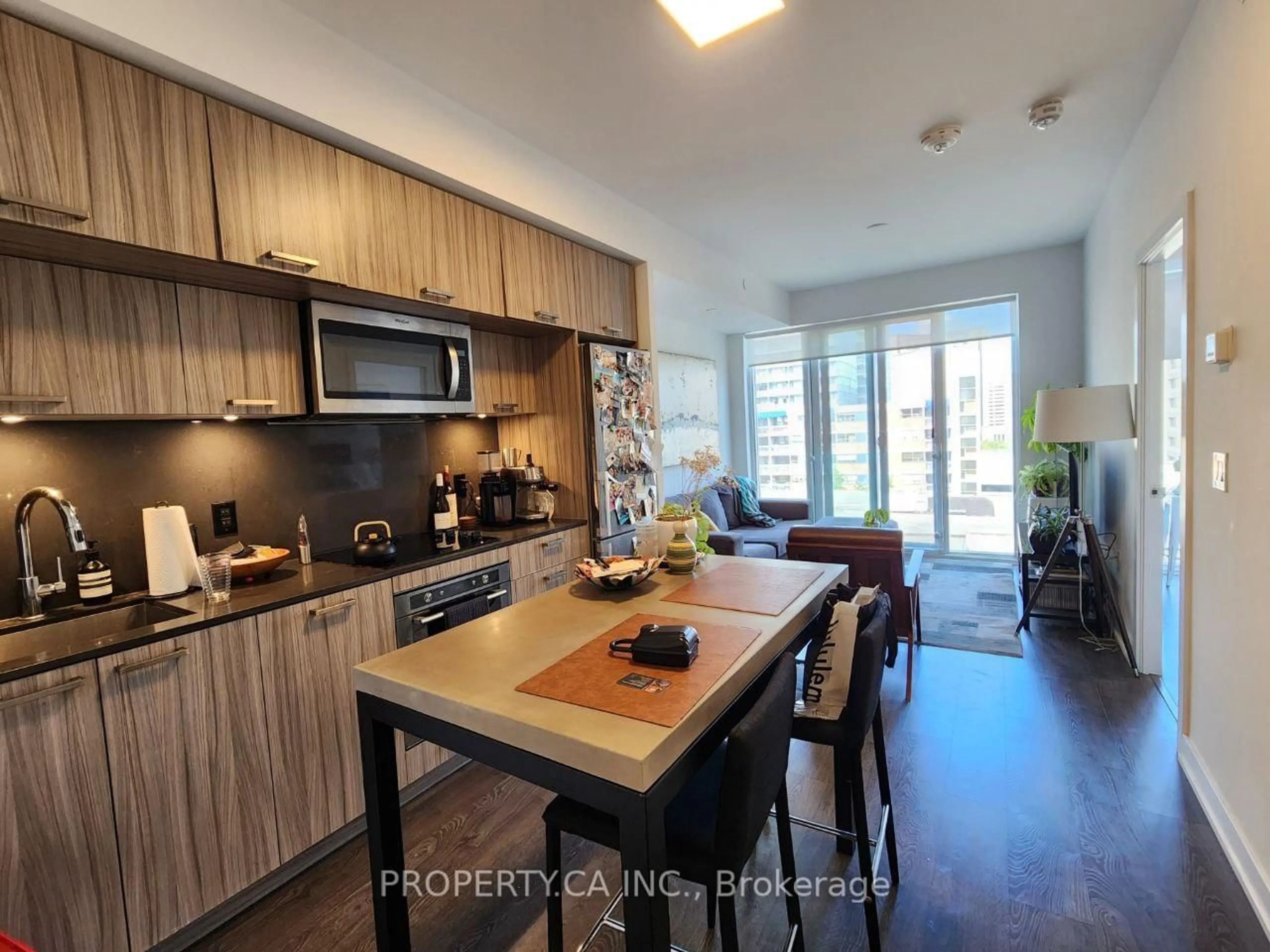 Open concept kitchen, wood/laminate floor for 50 McCaul St #910, Toronto Ontario M5T 1V9