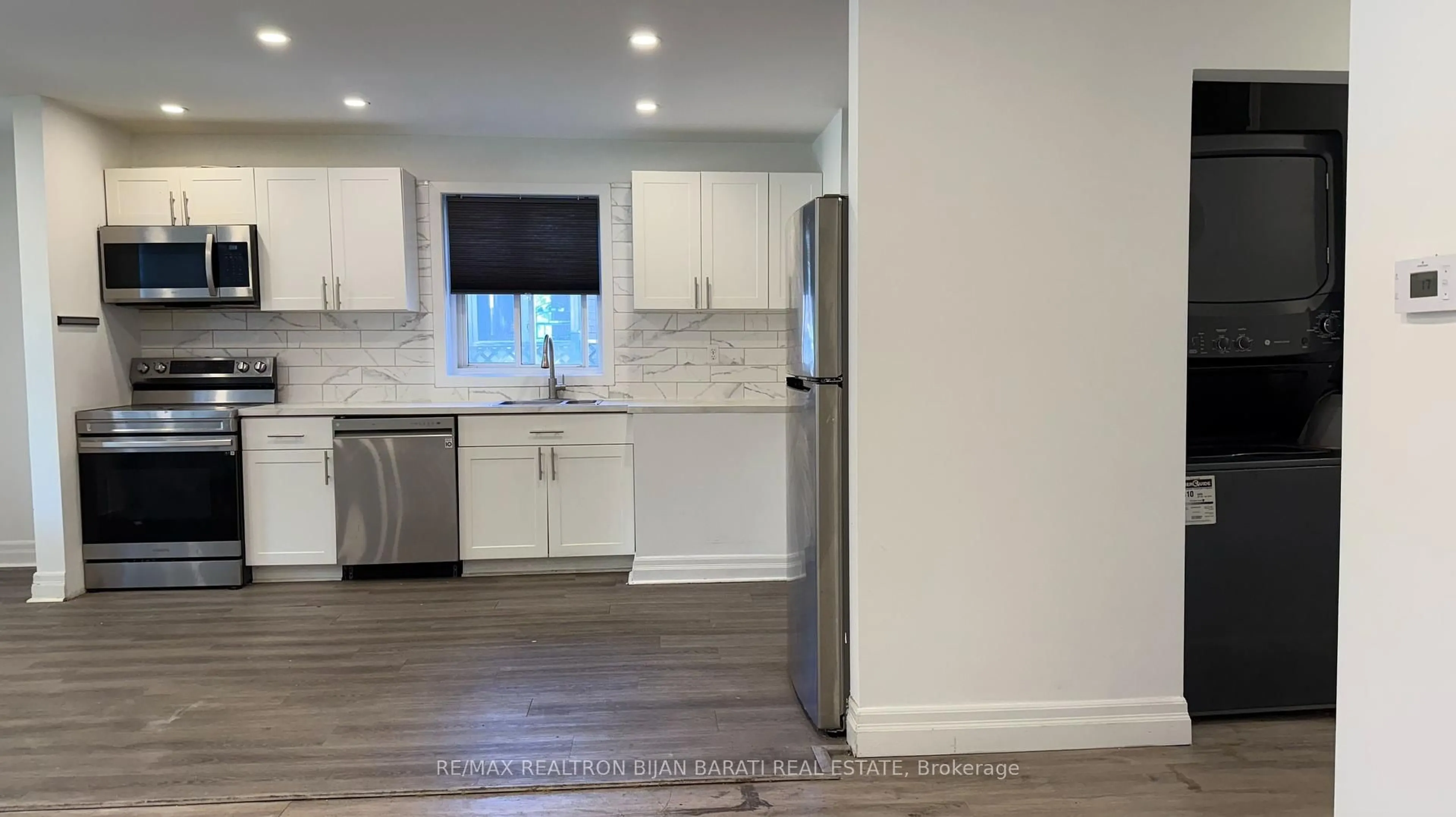 Open concept kitchen, wood/laminate floor for 208 Olive Ave, Toronto Ontario M2N 4P6