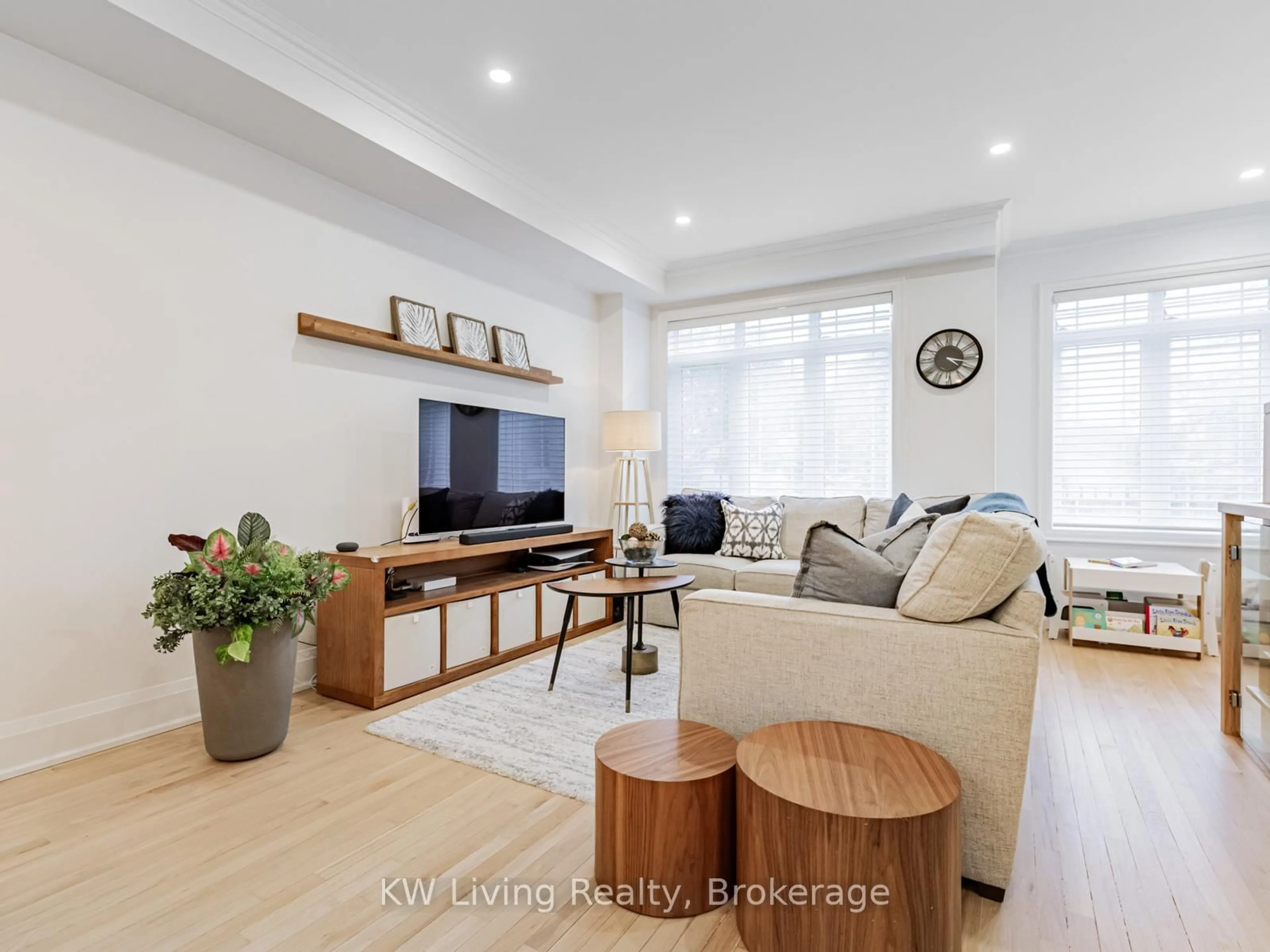 Living room with furniture, wood/laminate floor for 56 Wilkinson Dr, Toronto Ontario M2J 3Z5