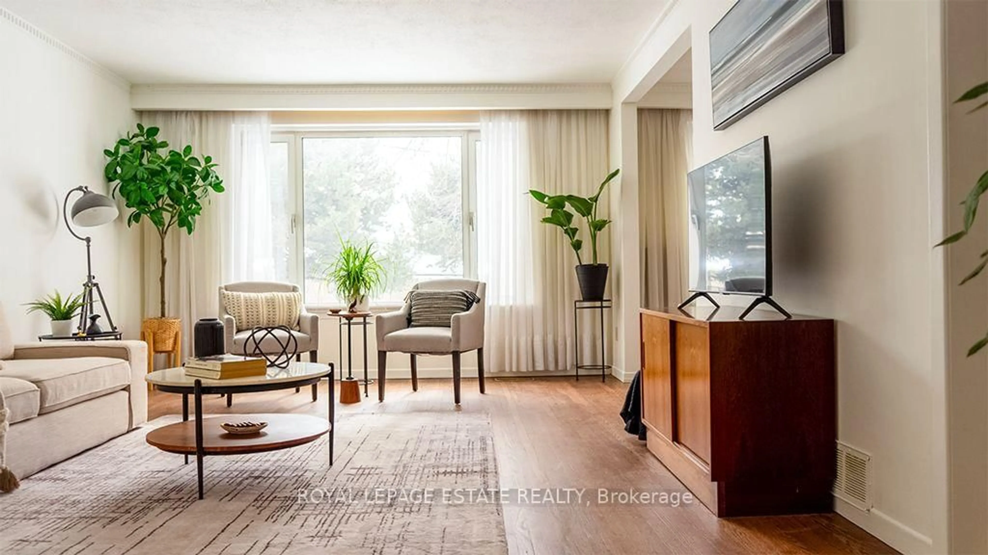 Living room with furniture, wood/laminate floor for 40 Dukinfield Cres, Toronto Ontario M3A 2S1