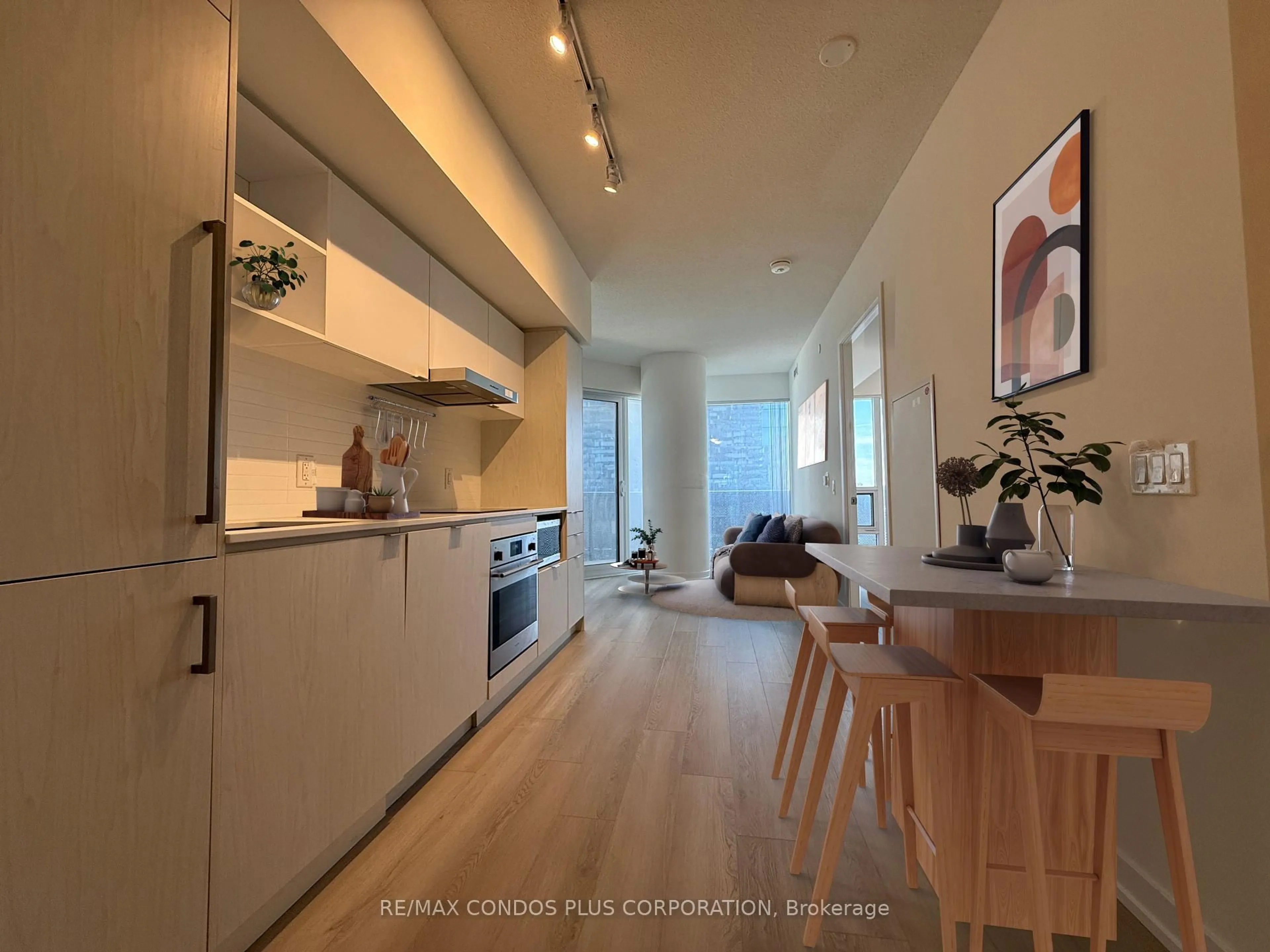Open concept kitchen, wood/laminate floor for 55 Cooper St #1609, Toronto Ontario M5E 0G1