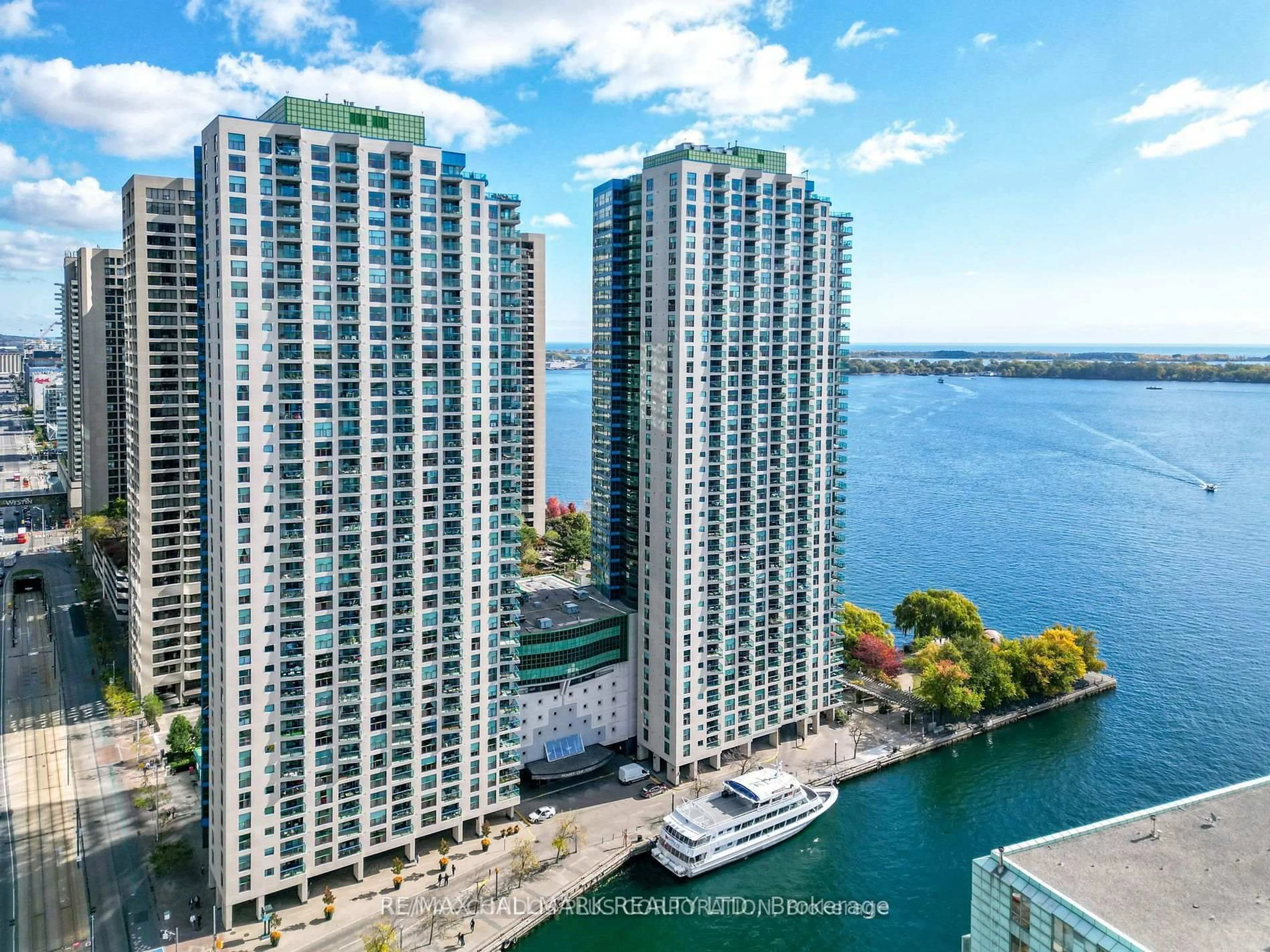 A pic from outside/outdoor area/front of a property/back of a property/a pic from drone, water/lake/river/ocean view for 77 Harbour Sq #502, Toronto Ontario M5J 2S2