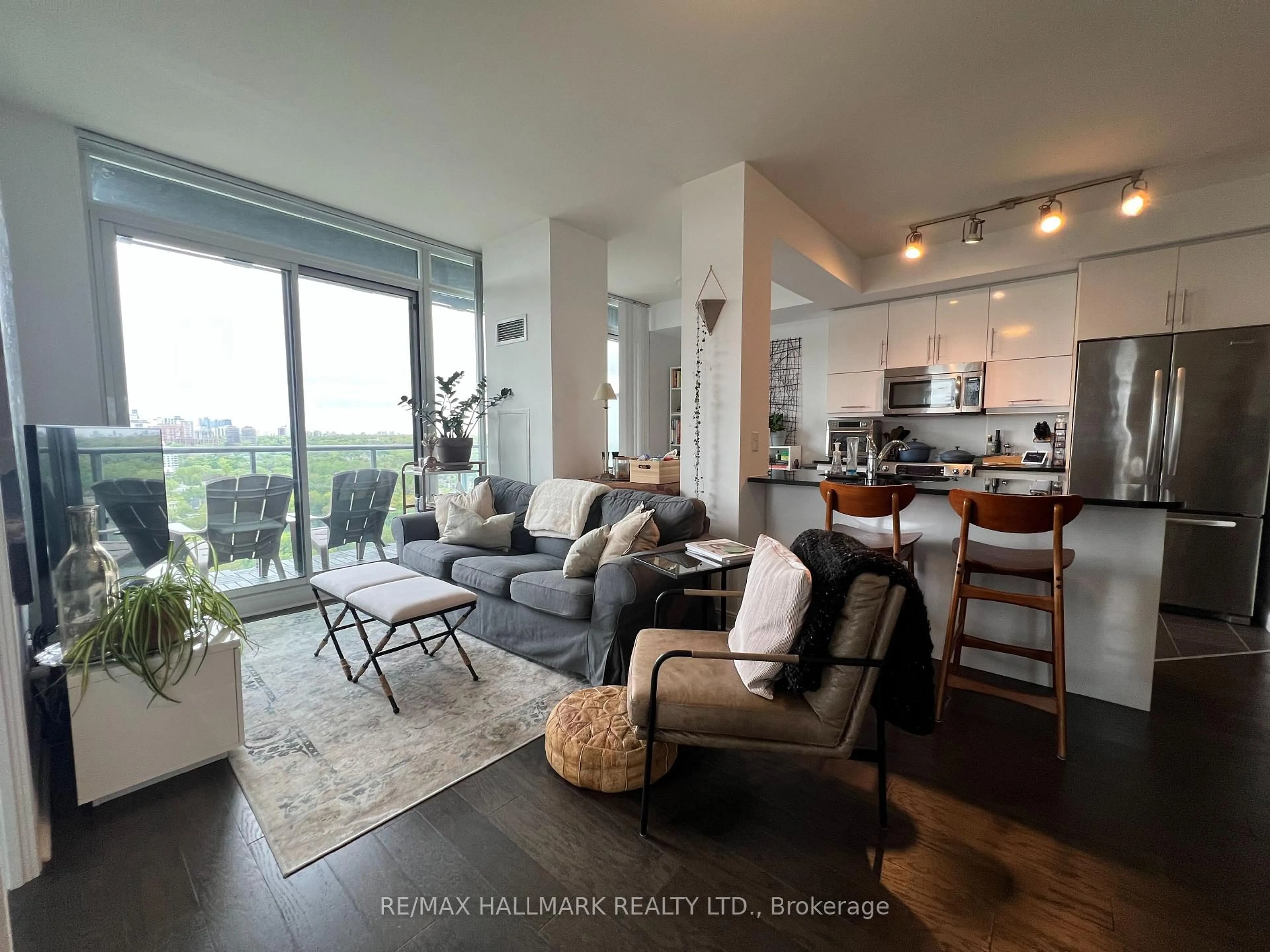 Living room with furniture, wood/laminate floor for 825 Church St #2302, Toronto Ontario M4W 3Z4