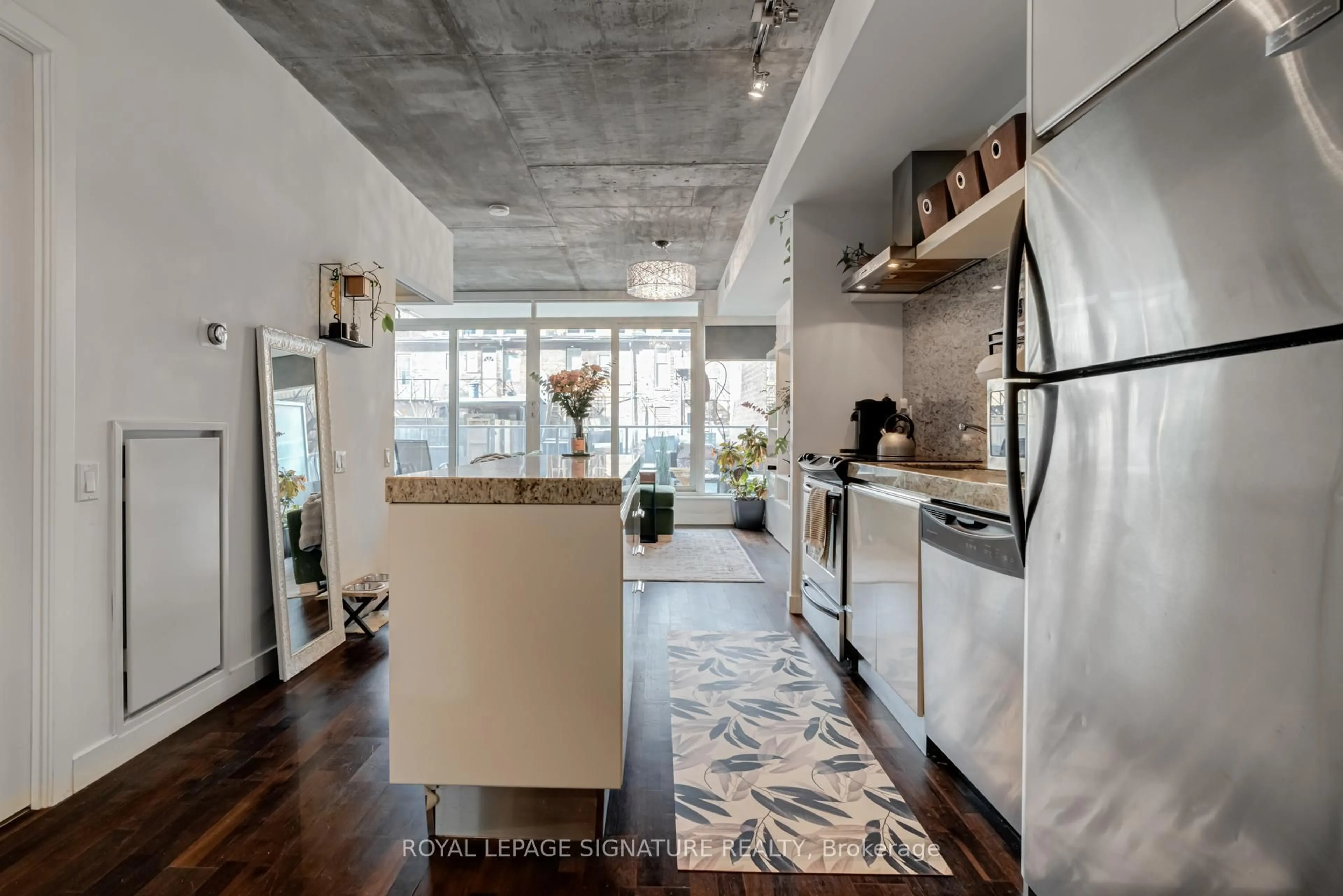 Open concept kitchen, cement floor for 75 Portland St #312, Toronto Ontario M5V 2M9