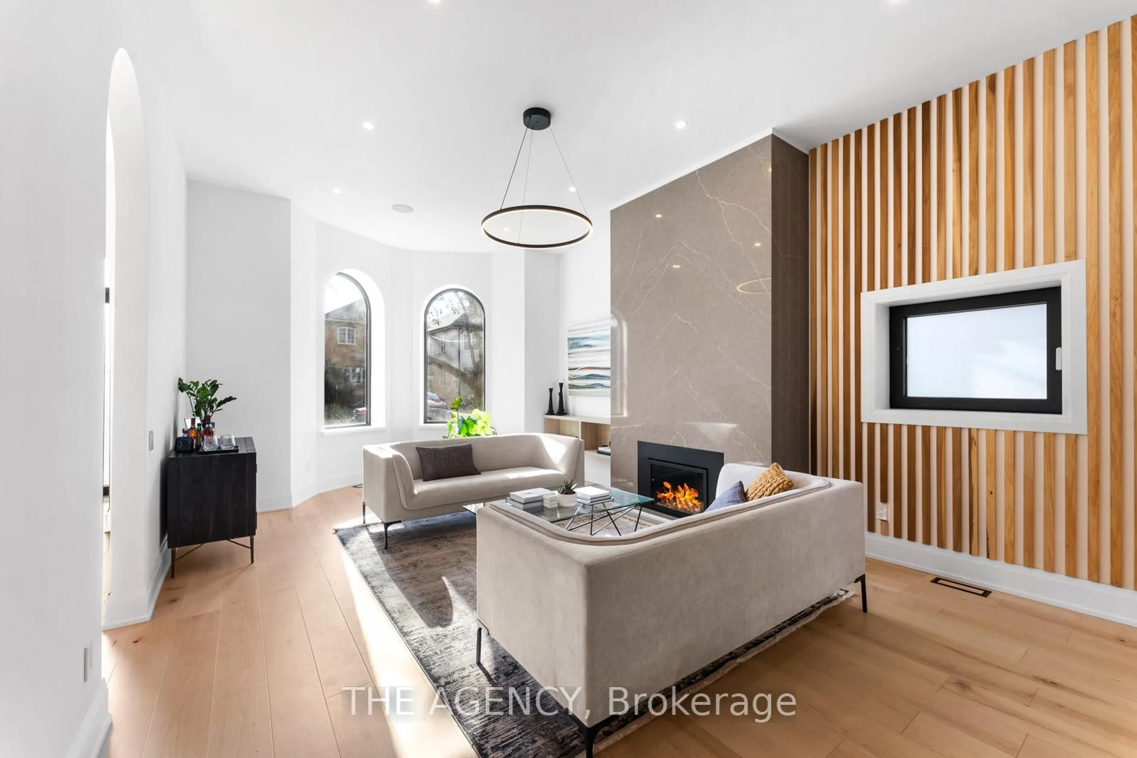 Living room with furniture, wood/laminate floor for 43 Rusholme Rd, Toronto Ontario M6J 3H3