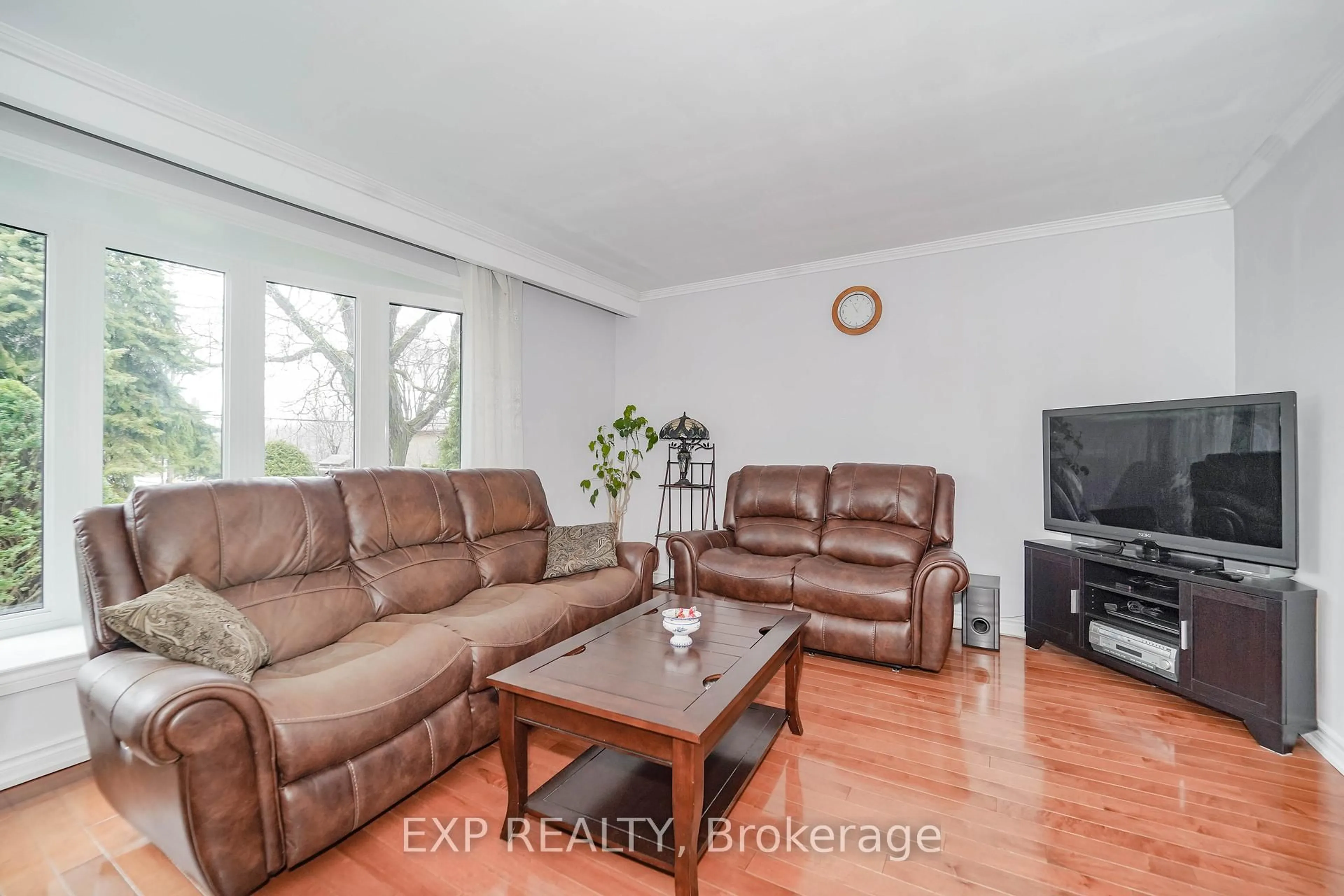 Living room with furniture, wood/laminate floor for 47 Combe Ave, Toronto Ontario M3H 4J5
