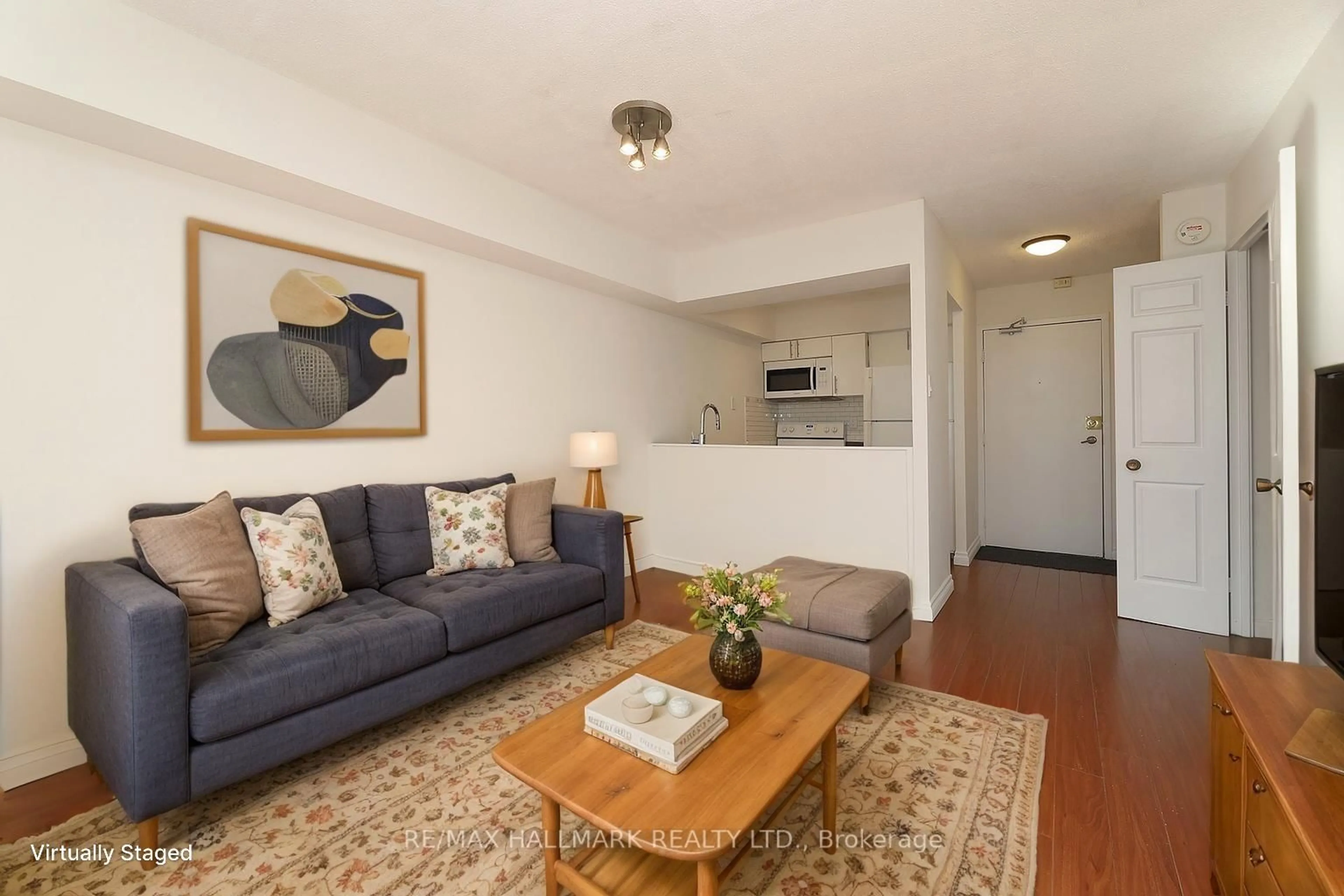 Living room with furniture, wood/laminate floor for 105 Mccaul St #506, Toronto Ontario M5T 2X4