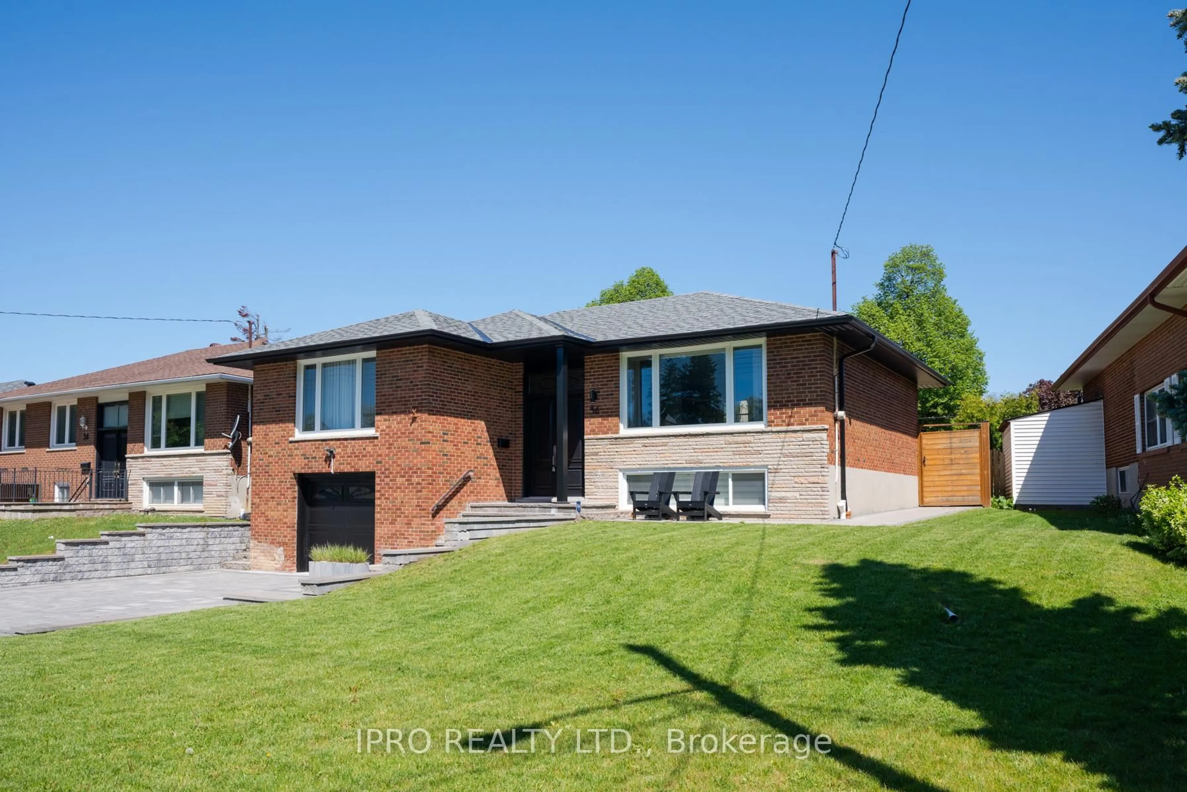 Home with brick exterior material, street for 36 Ruscica Dr, Toronto Ontario M4A 1R1