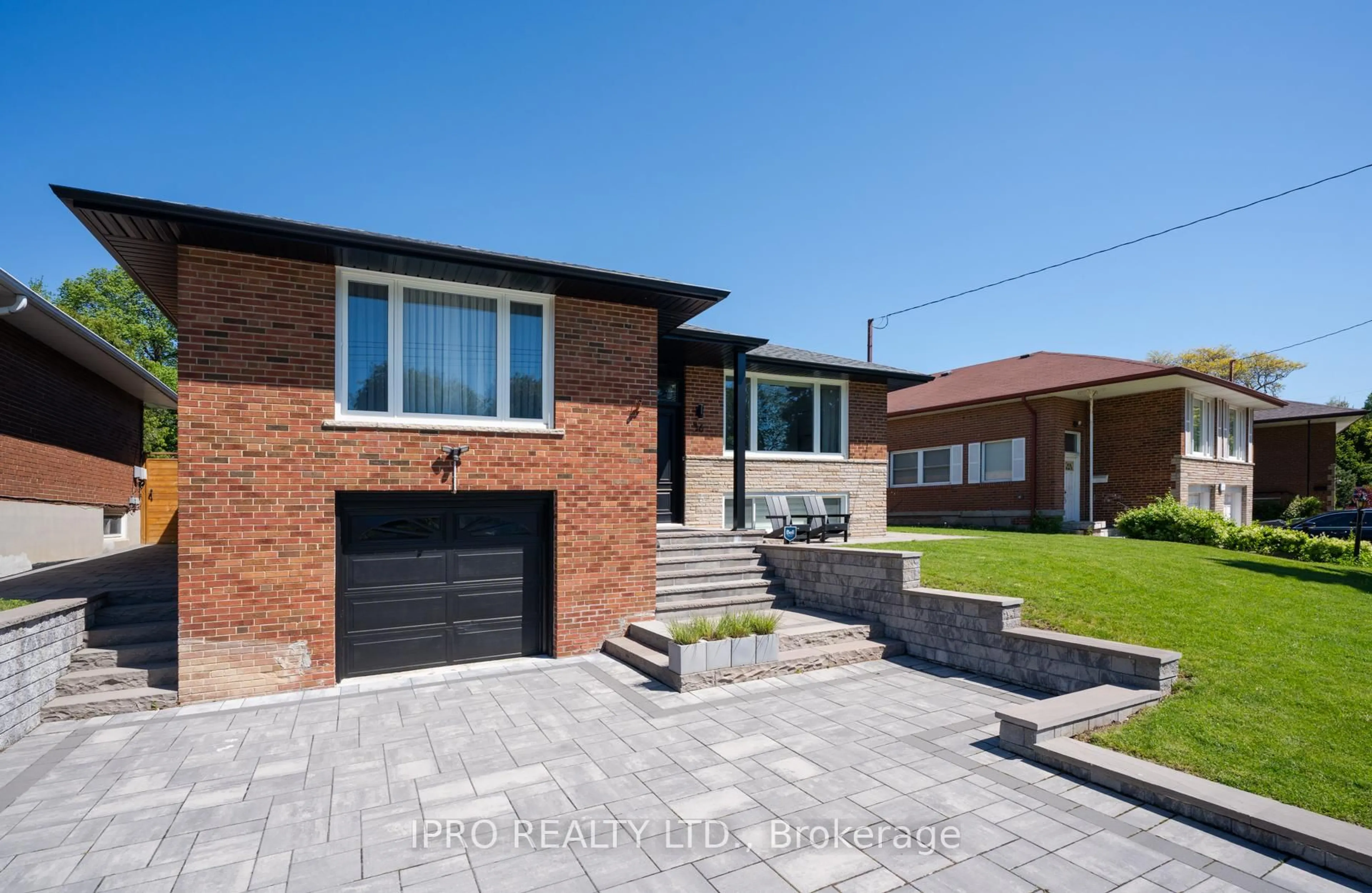 Home with brick exterior material, street for 36 Ruscica Dr, Toronto Ontario M4A 1R1