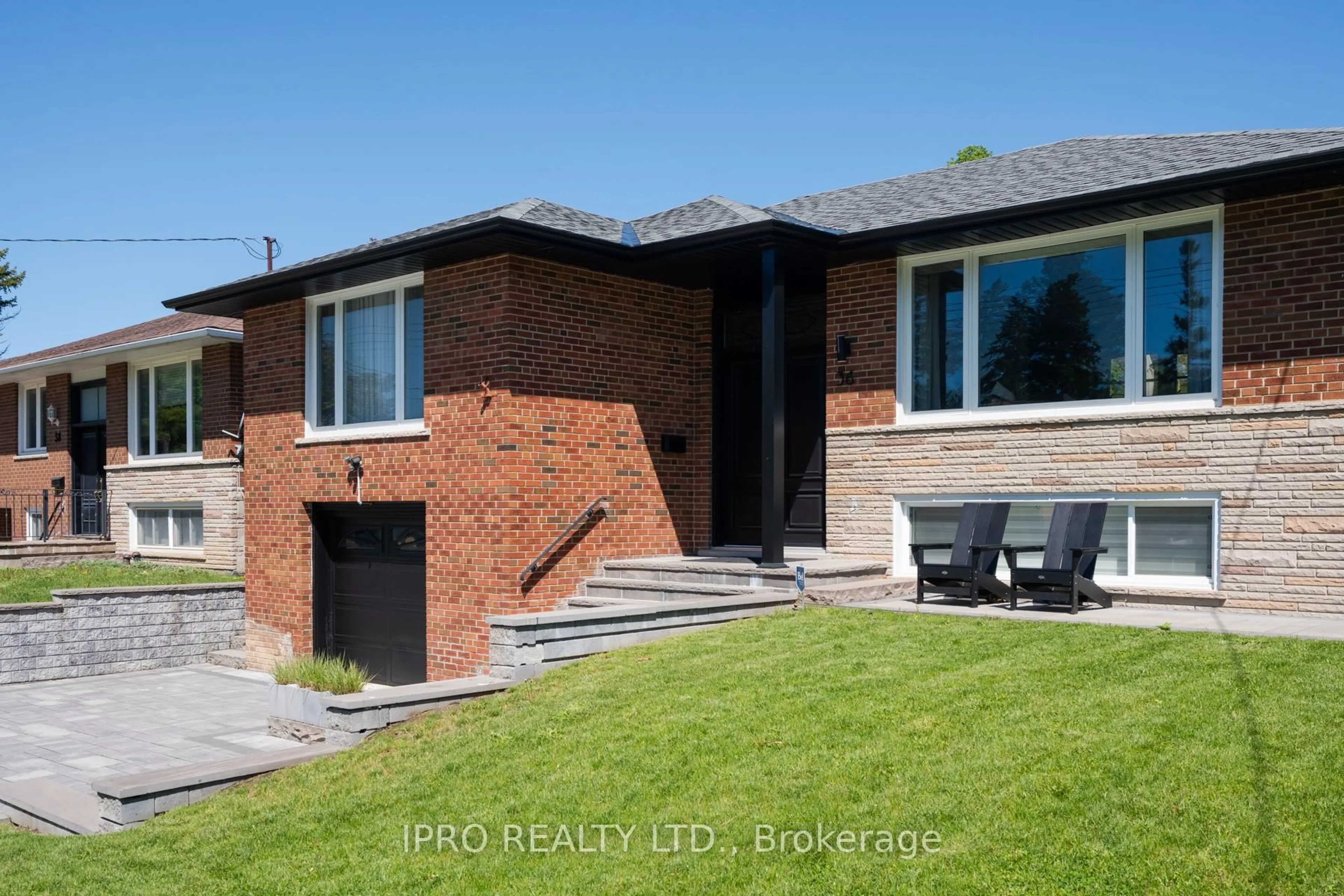 Home with brick exterior material, street for 36 Ruscica Dr, Toronto Ontario M4A 1R1
