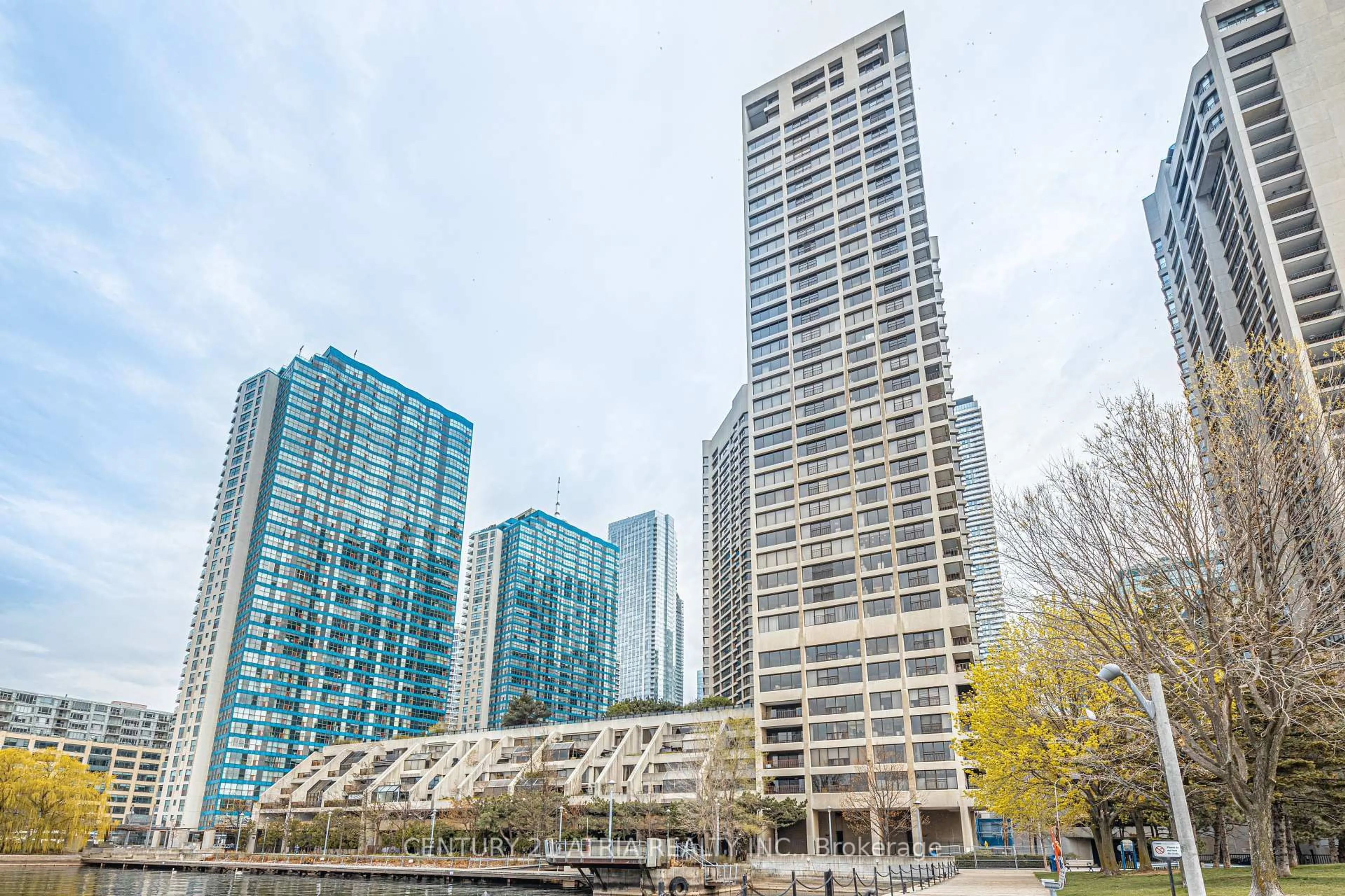 Patio, city buildings view from balcony for 65 Harbour Sq #1401, Toronto Ontario M5J 2L4