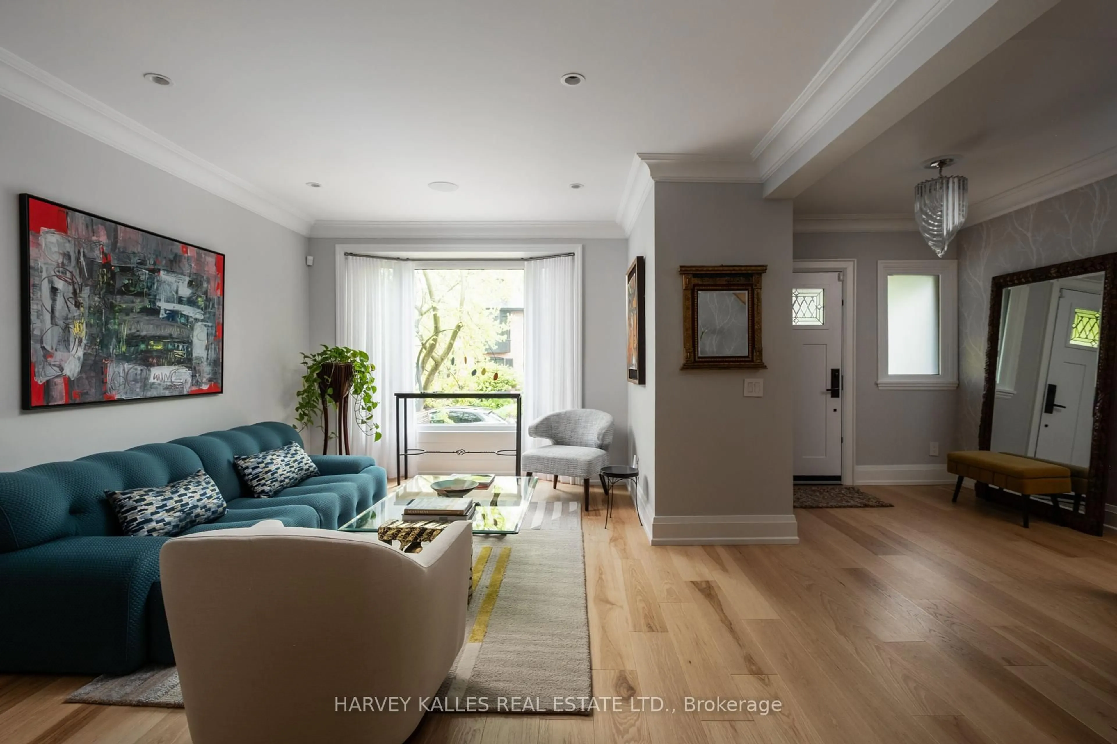 Living room with furniture, wood/laminate floor for 26 McMaster Ave, Toronto Ontario M4V 1A9