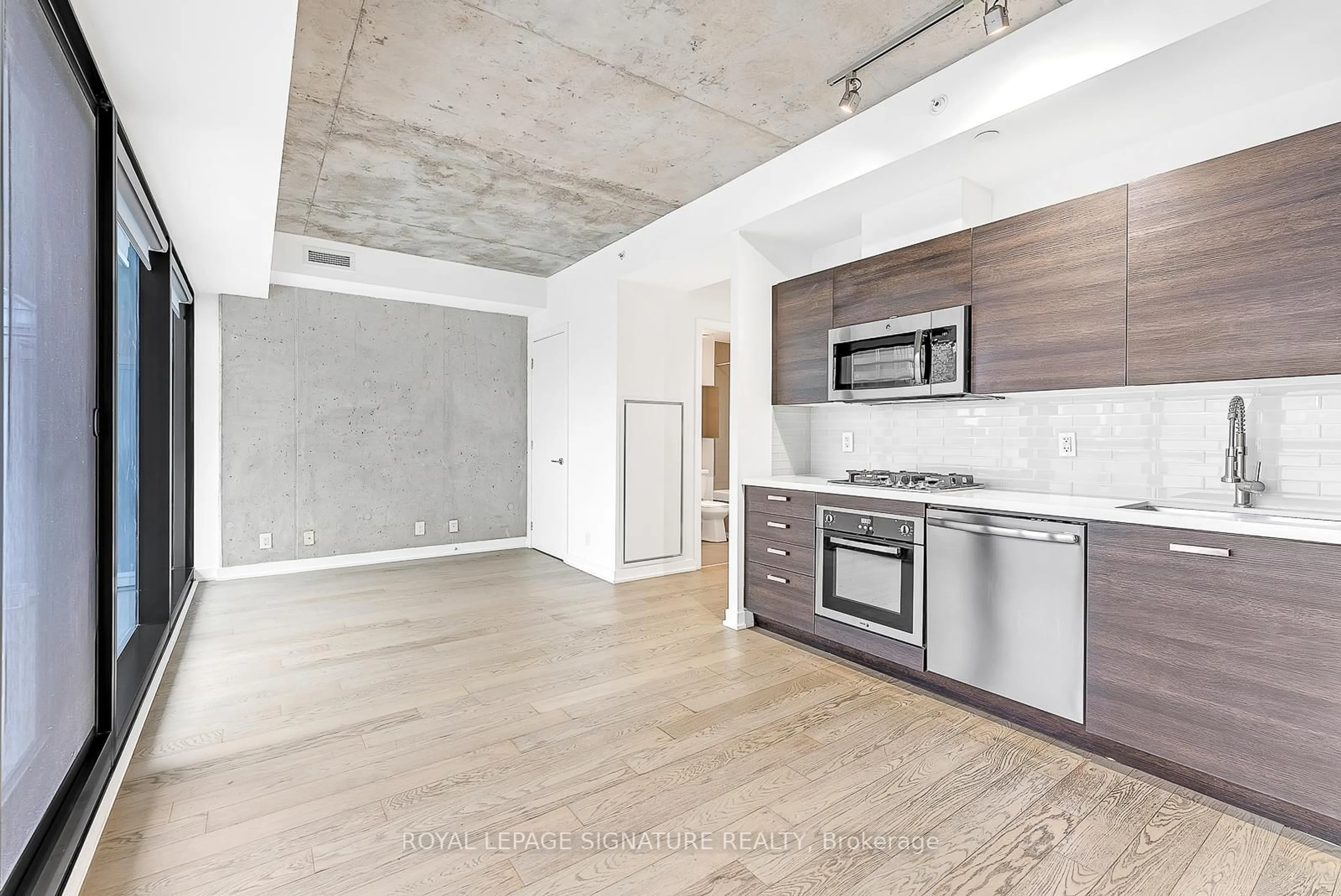 Open concept kitchen, cement floor for 11 Charlotte St #2201, Toronto Ontario M5V 0M6